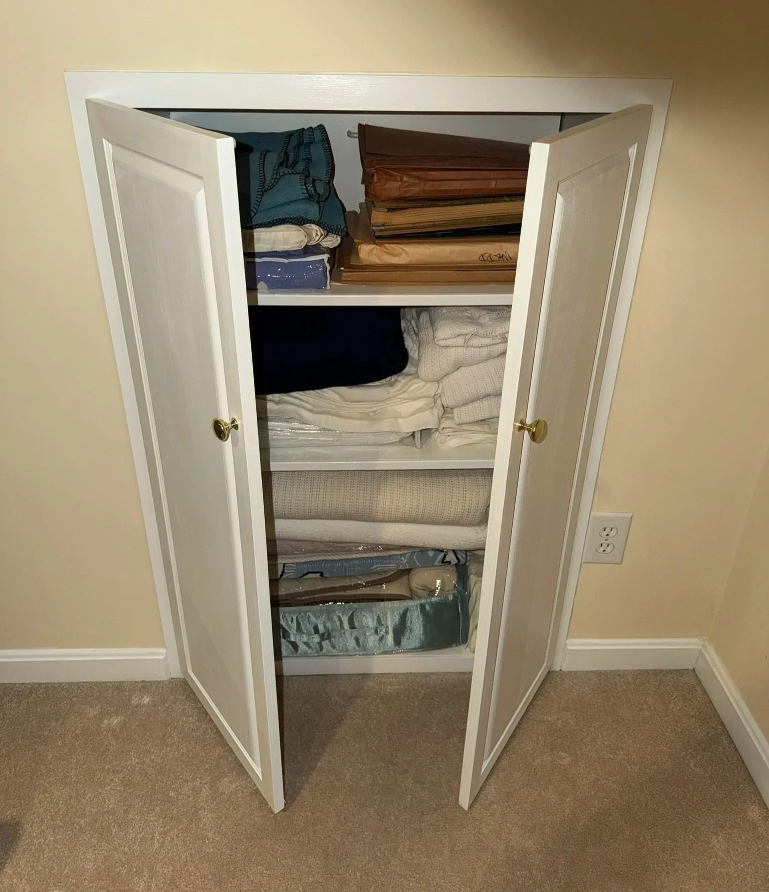 Knee-Wall Built-Ins: Take advantage of wasted space behind a knee wall to gain additional storage without "shrinking" the room with a floor-standing cabinet. This custom built-in linen cabinet takes full advantage of the available knee wall height an