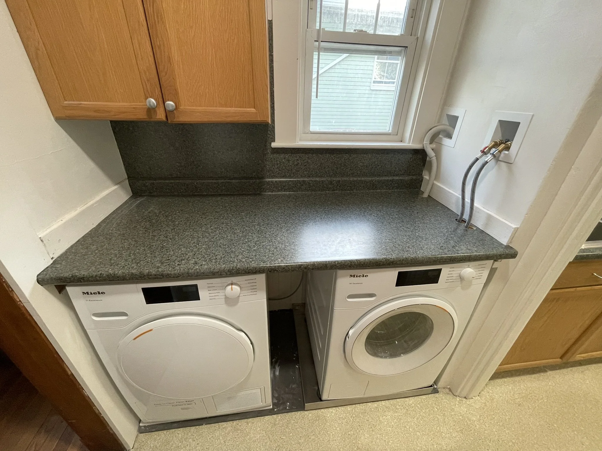 In-Unit Laundry: Laundry Day was always a challenge for residents of the 2nd floor apartment in this 100-year-old 2-family house.  It involved multiple trips up and down two long, narrow flights of stairs to the dusty, dimly lit basement. The homeown