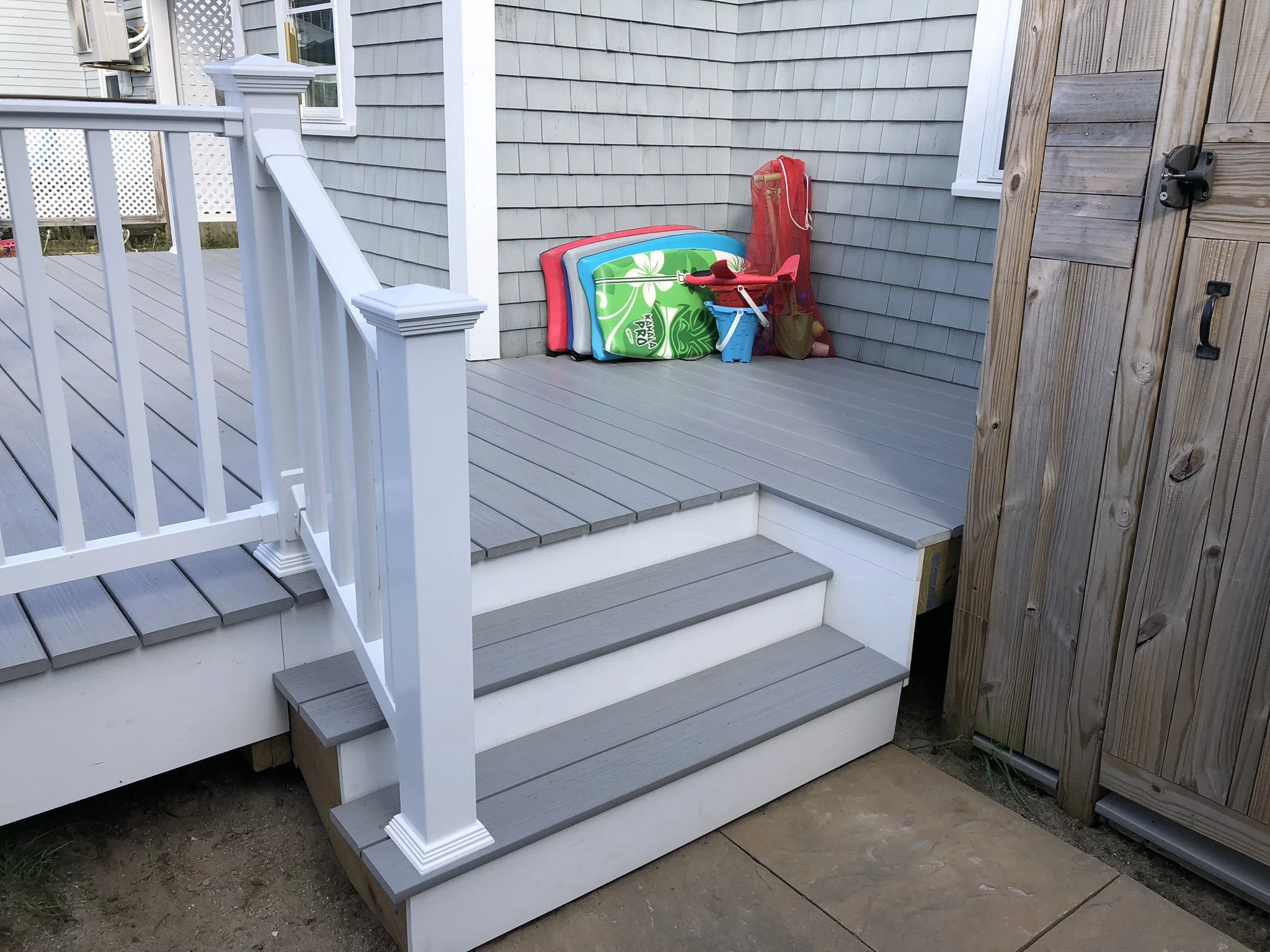335 S.F. Deck Replacement: This project was a complete replacement of a previous cedar deck, including nine new Diamond Pier DP75 footings and pressure treated framing. Fiberon Paramount solid PVC decking was secured with concealed screws throughout.