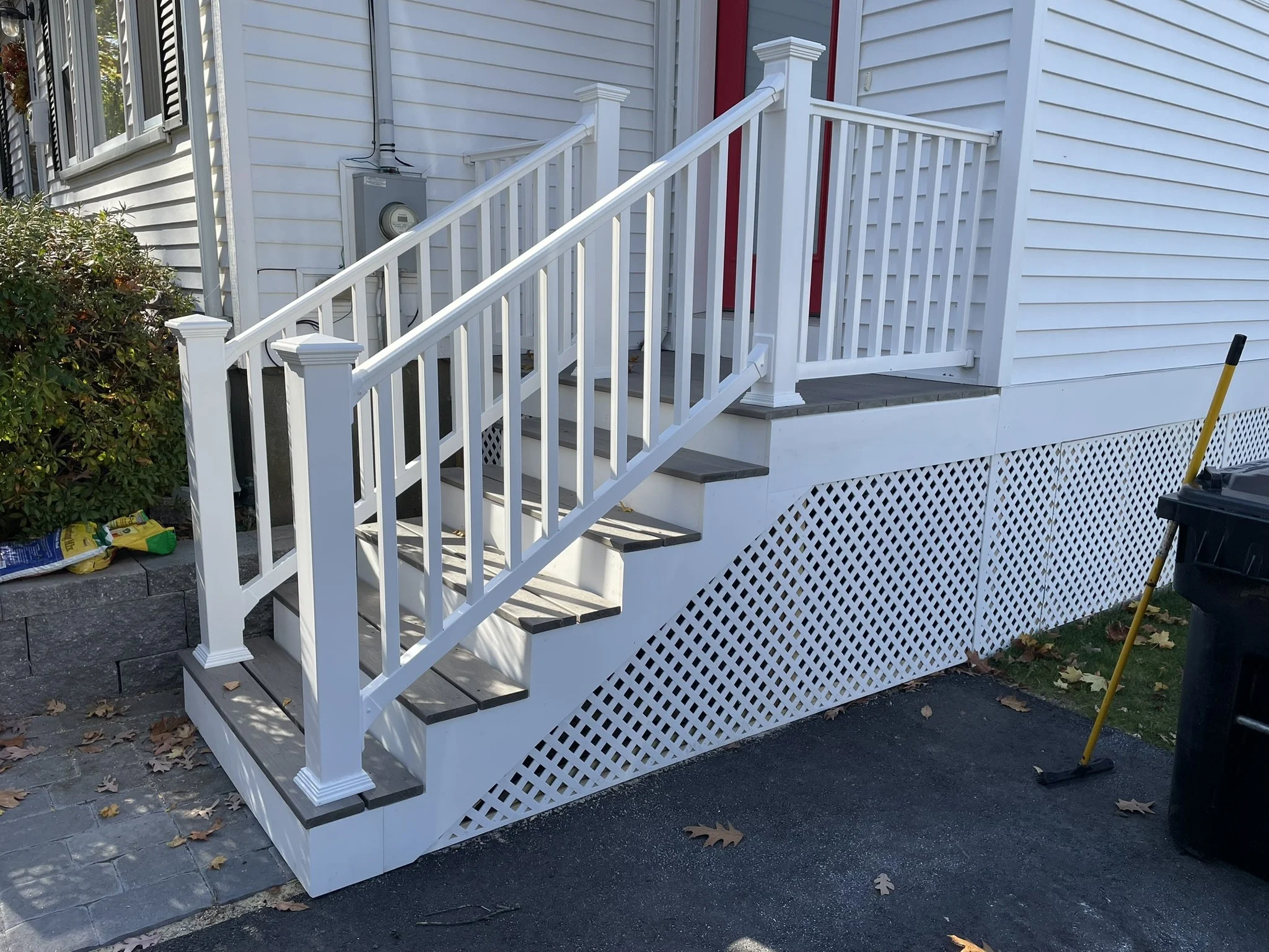 Porch Staircase Replacement: After a prior contractor's work failed inspection, I was hired to completely rebuild the stairs and install new Trex Transcend Lineage composite decking, Versatex PVC risers and Fairway V110 PVC railings. Two sets of cust