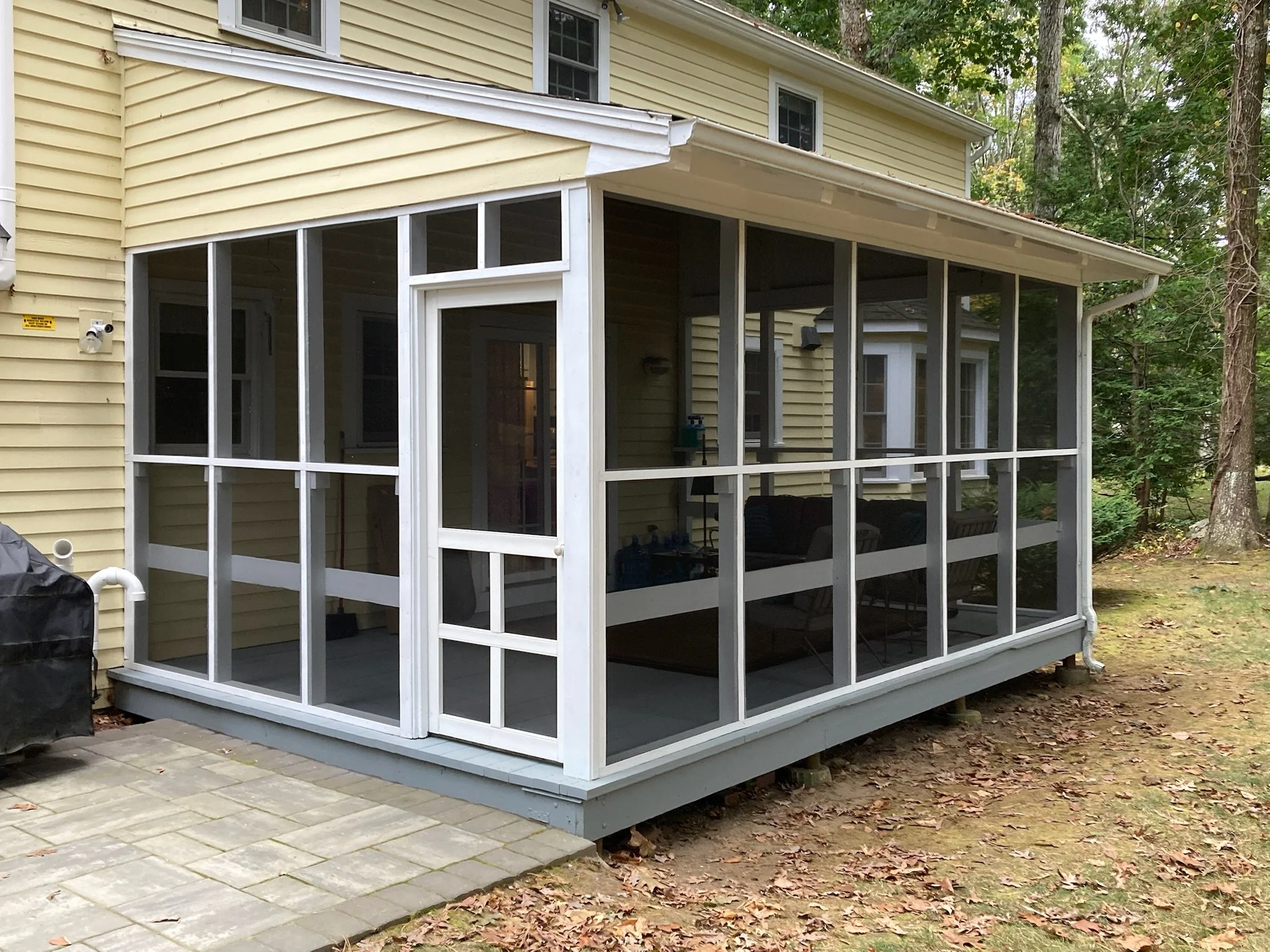 Structural Porch Repairs: A simple re-screening project uncovered substantial structural issues, most notably extensive rot and the presence of carpenter ants in the corner posts and rim joists. All rotted wood was cut away and replaced with pressure