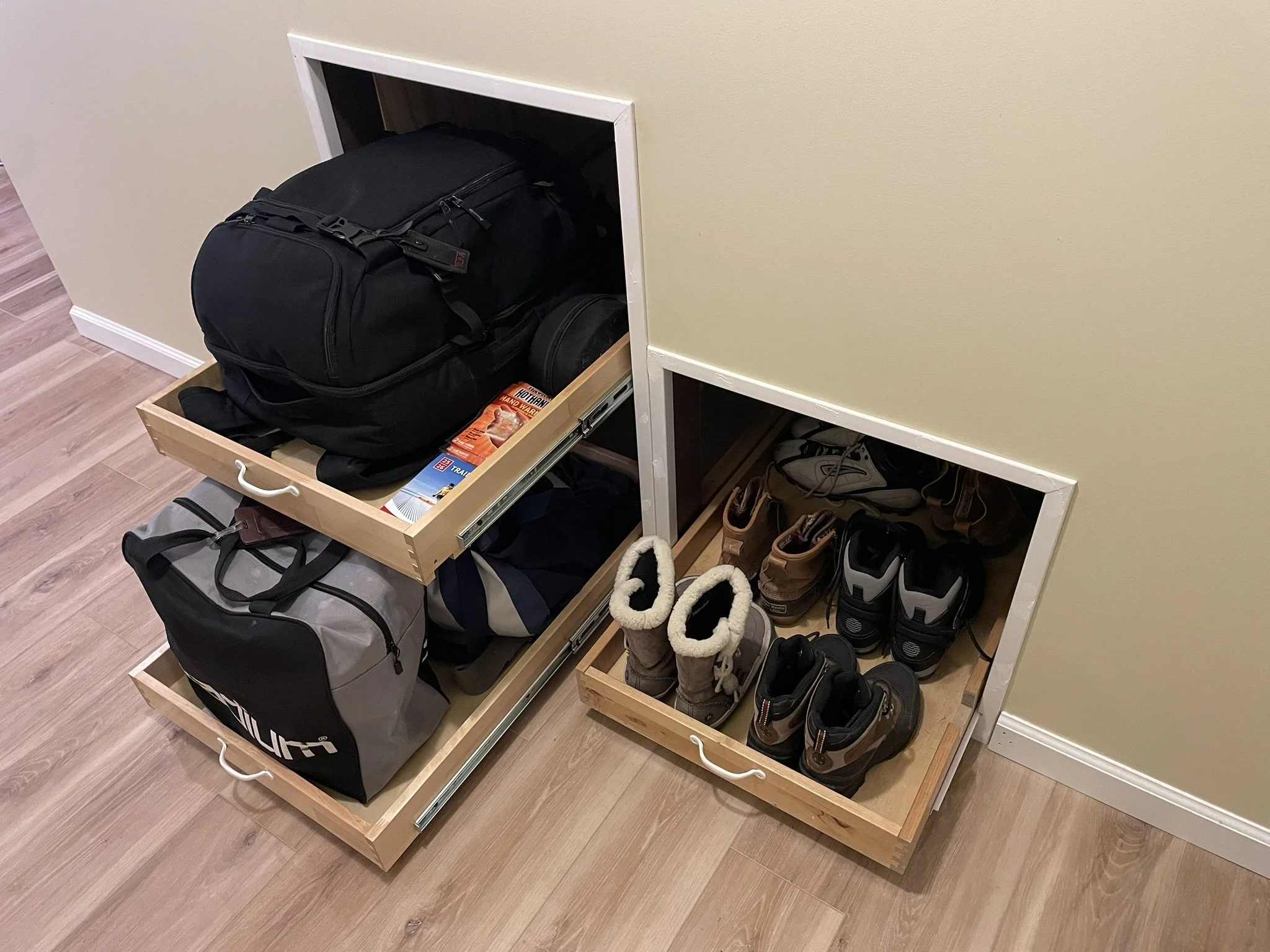 Under-Stairs Storage Drawers: That awkward space under basement stairs is such a waste ... until it's not. Three 32" x 21" full-extension drawers were added under the lower stairs, providing an easily accessible home for ski boots, off-season footwea
