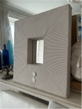 Small upholstered beach style mirror