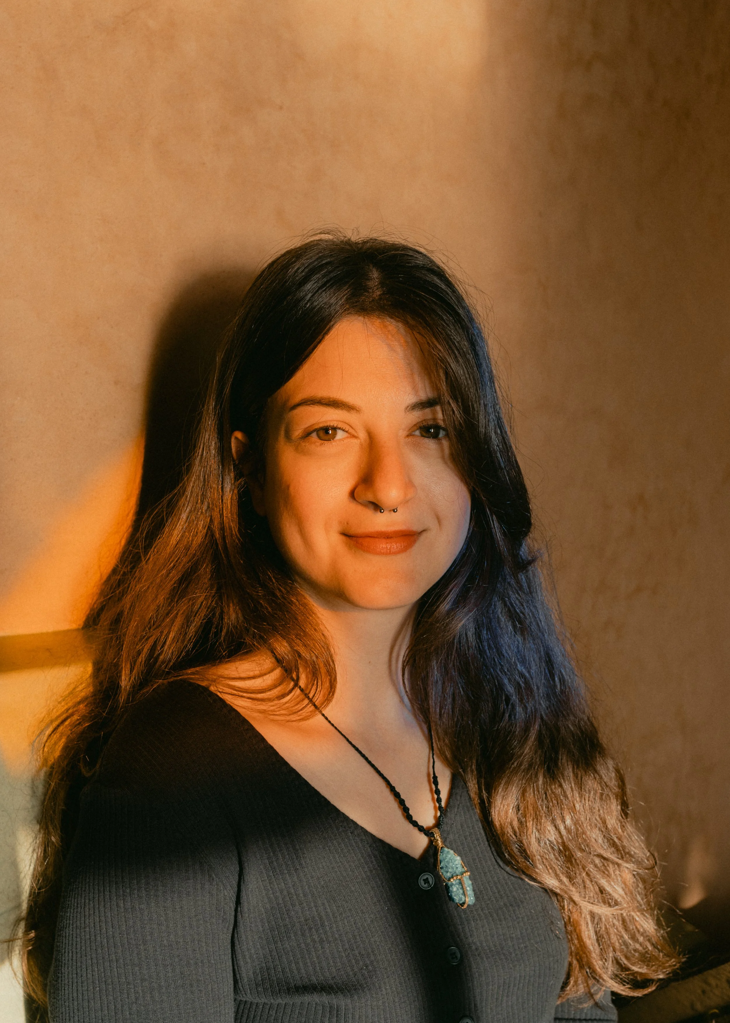 Maria dimitreli, a hypnotherapist, looking at the camera and smiling