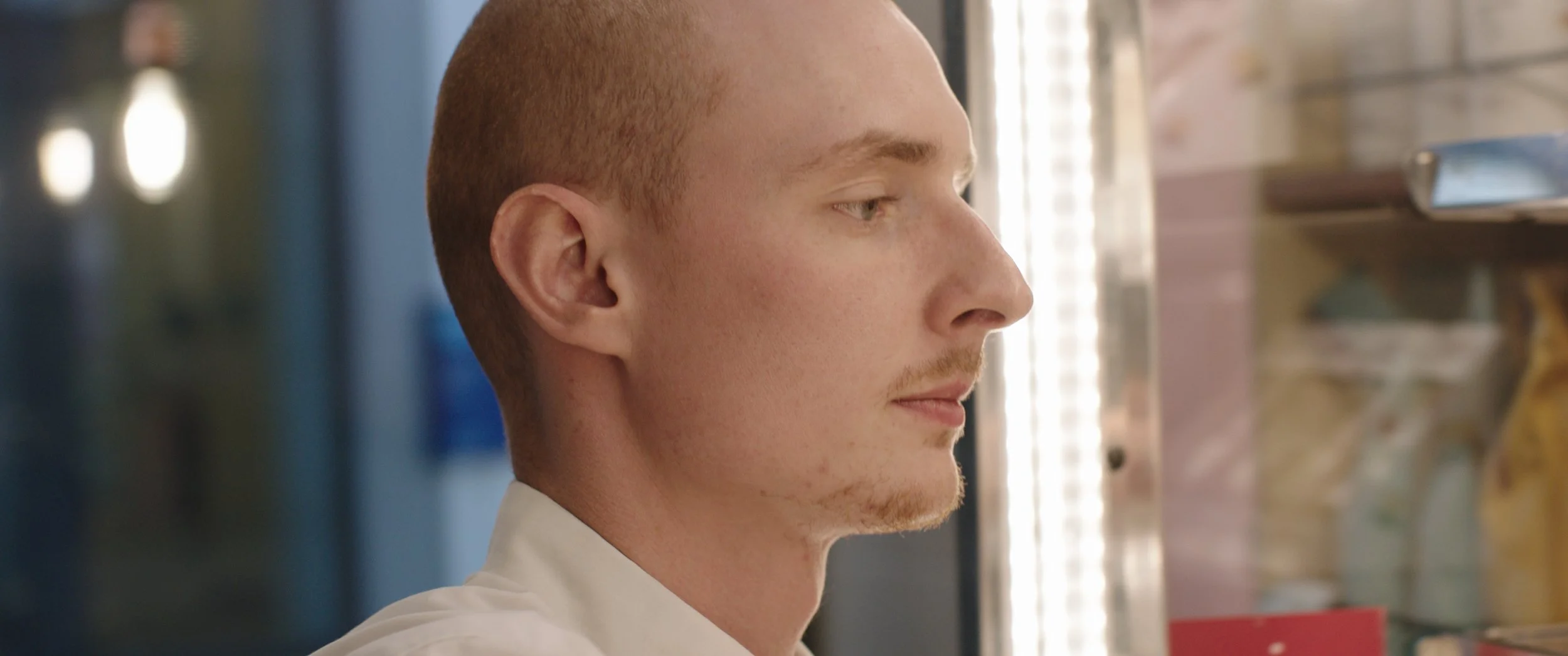 A Pret worker places sandwiches in the fridge