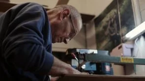 Rob Roy works on a piece of wood in his workshop