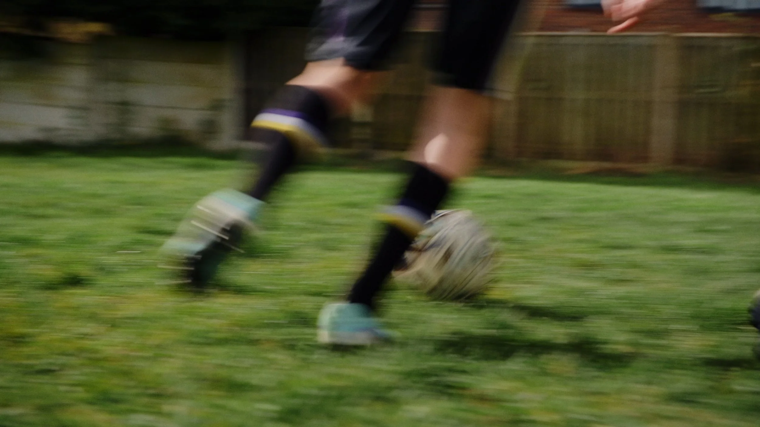 Emily runs while playing football