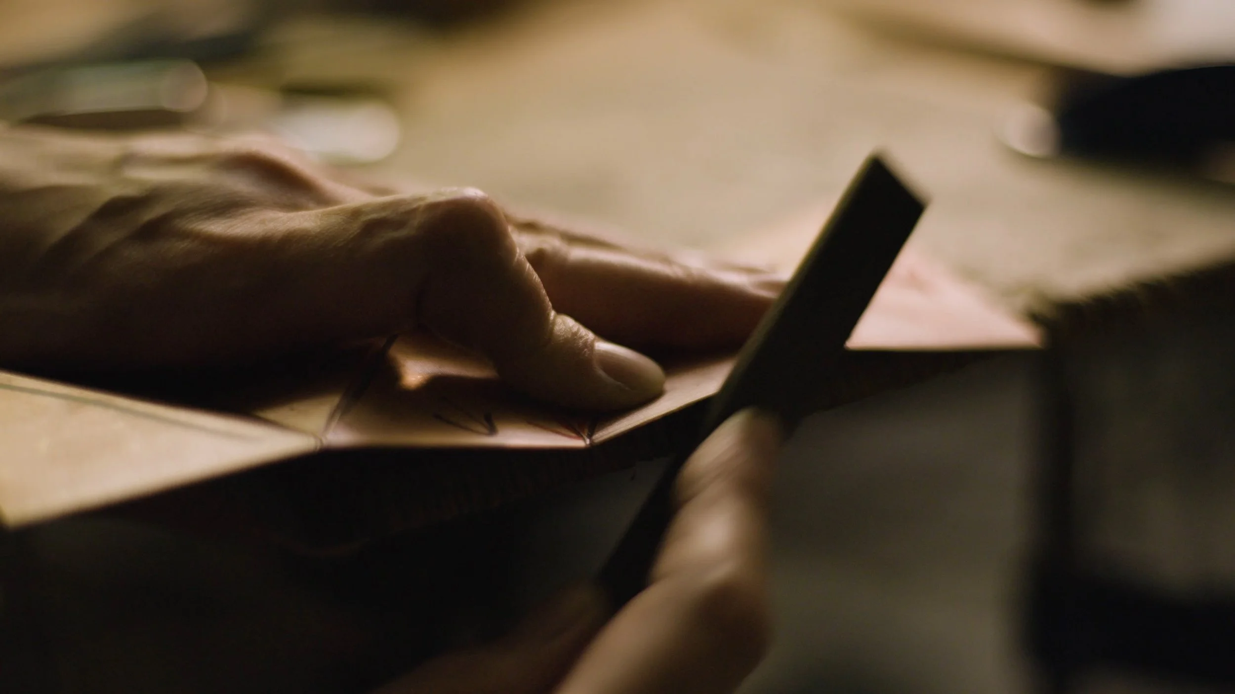 Kei Tominaga files down a piece of metal