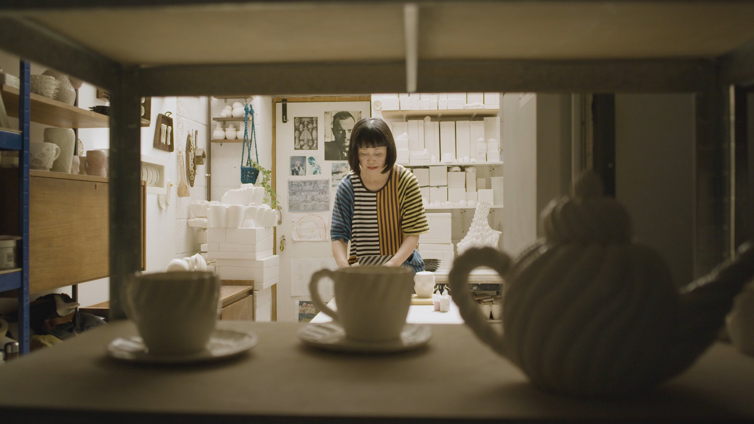 Ikuko Iwamoto arranges things on her desk