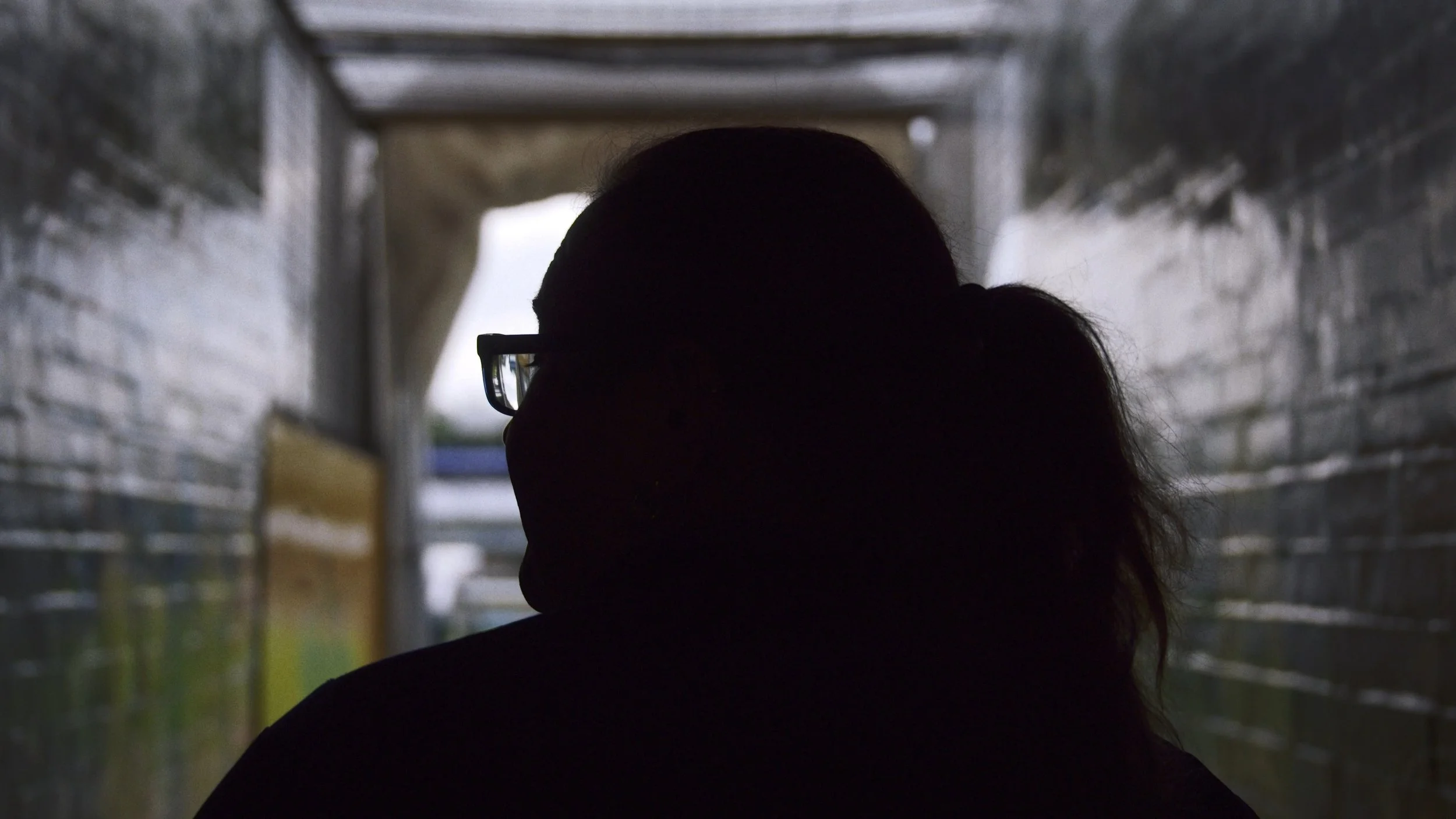 Lucy Clark stands in the tunnel in silhouette