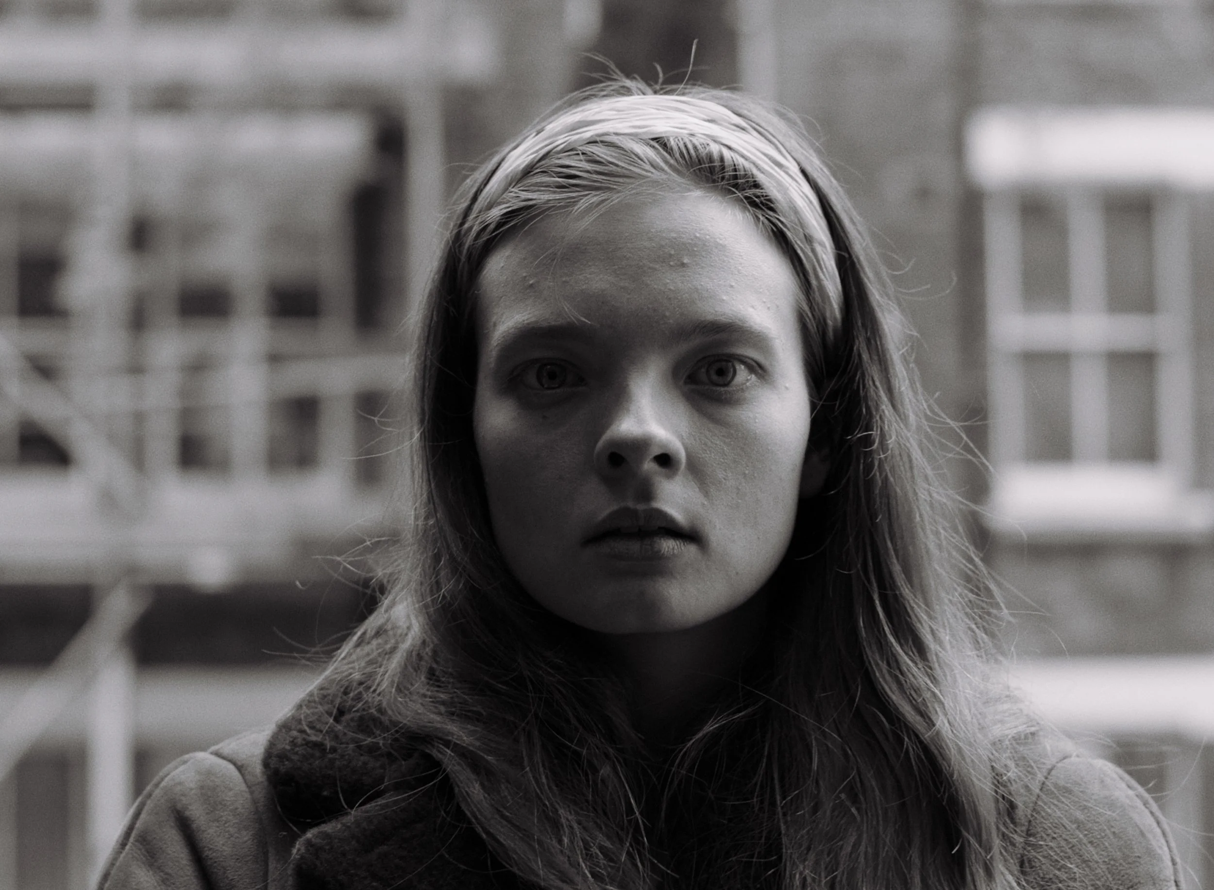 A woman looks towards camera