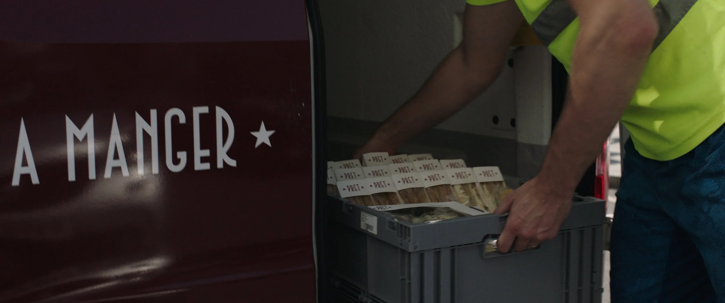 A crate of Pret sandwiches are taken from a van