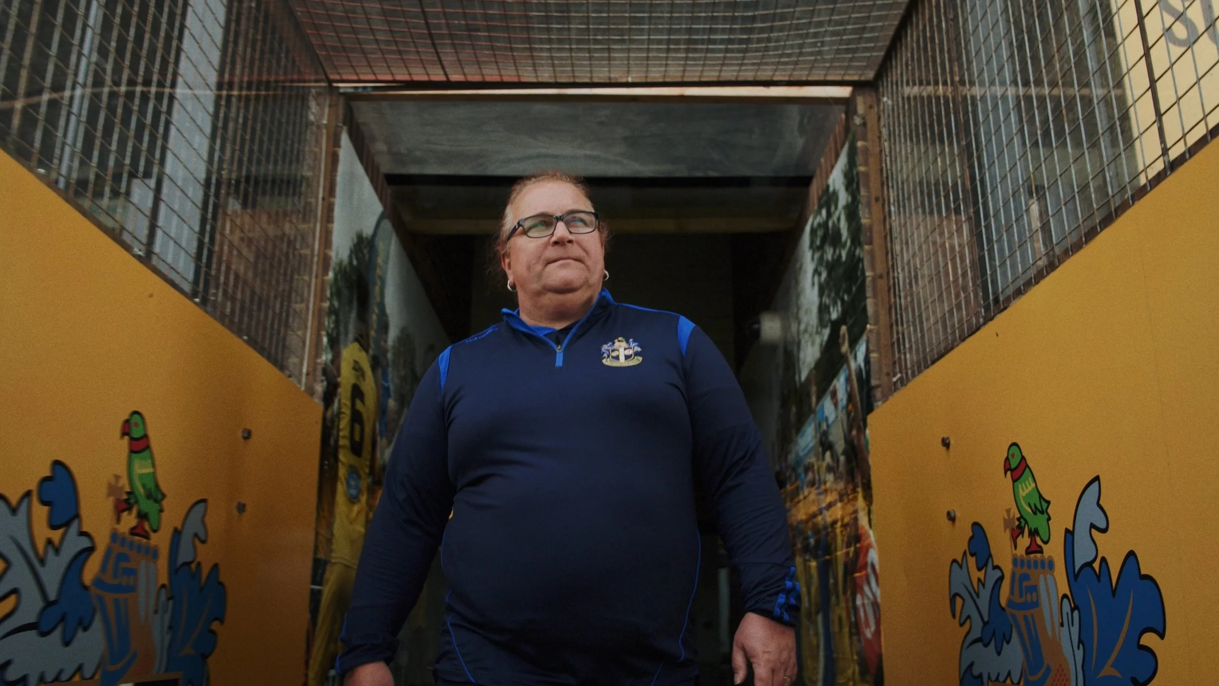 Lucy Clark walks onto the football field