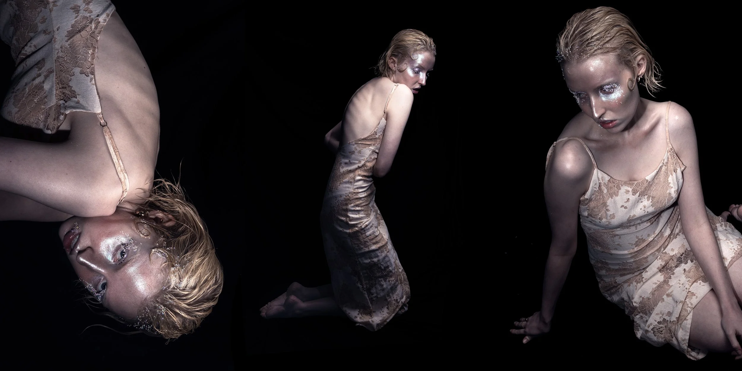 Three women in matching beige lace slip dresses with glittery makeup and wet hair pose against a black background, each in different kneeling or sitting positions.