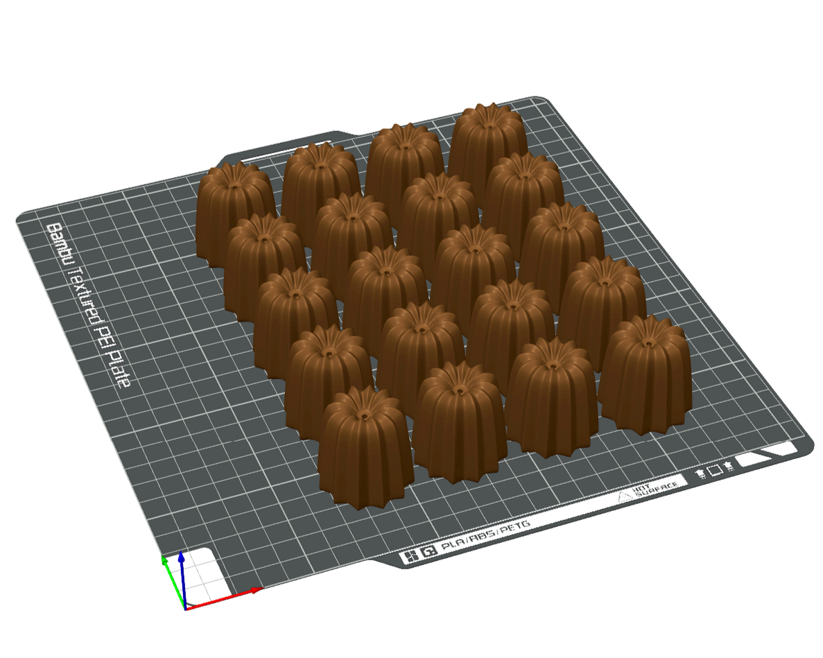 A 3D printed model of multiple chocolate pudding cups with a fluted shape, arranged on a 3D printing build platform.