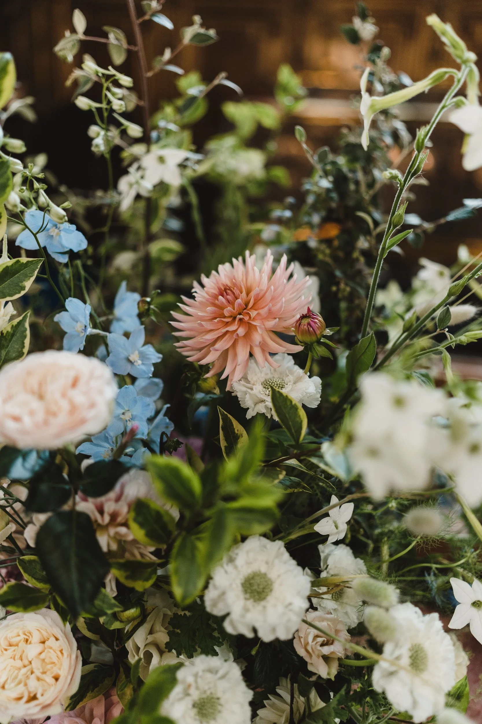 Elegant floral display arranged for a wedding reception at Oxford University in Oxford, England