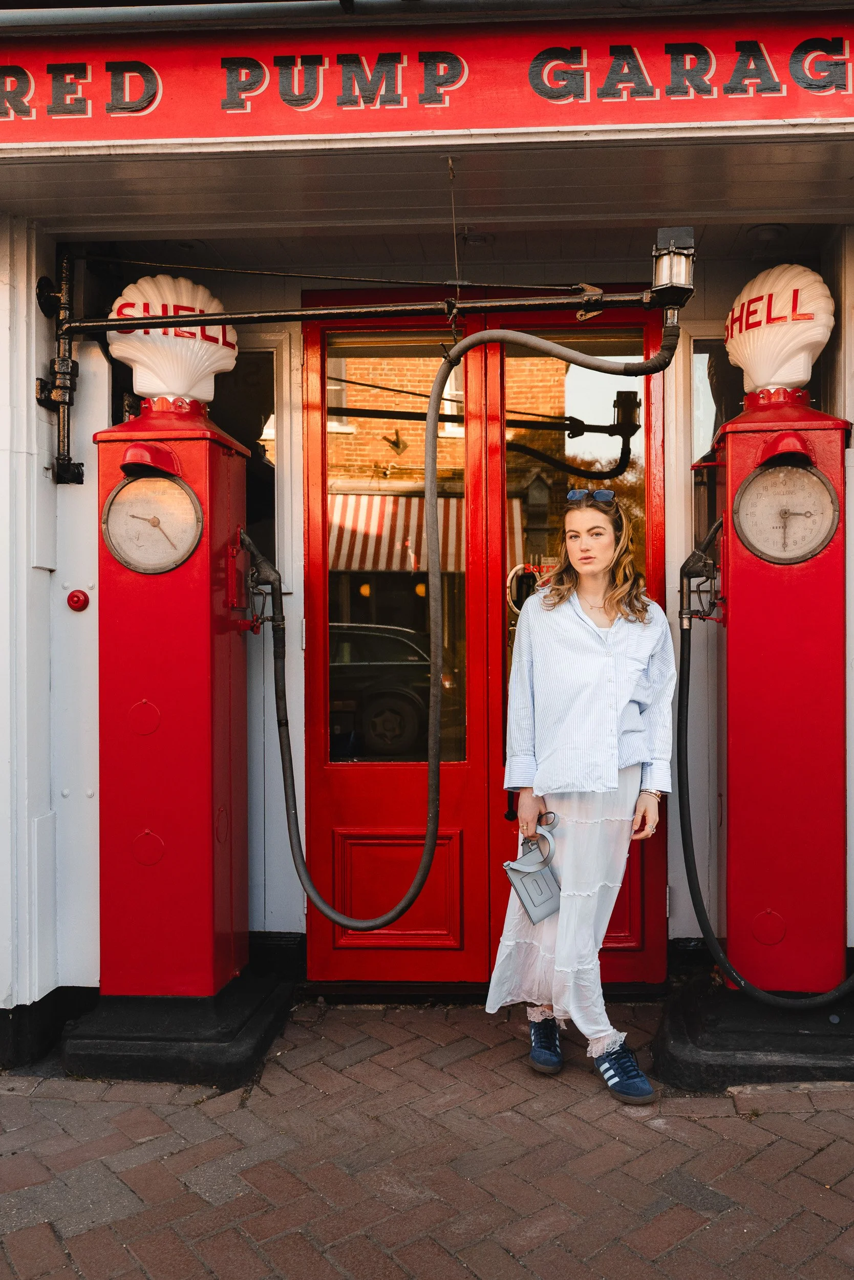 Natural school leaver portrait photoshoot at a vintage petrol station during golden hour in Great Missenden, Buckinghamshire