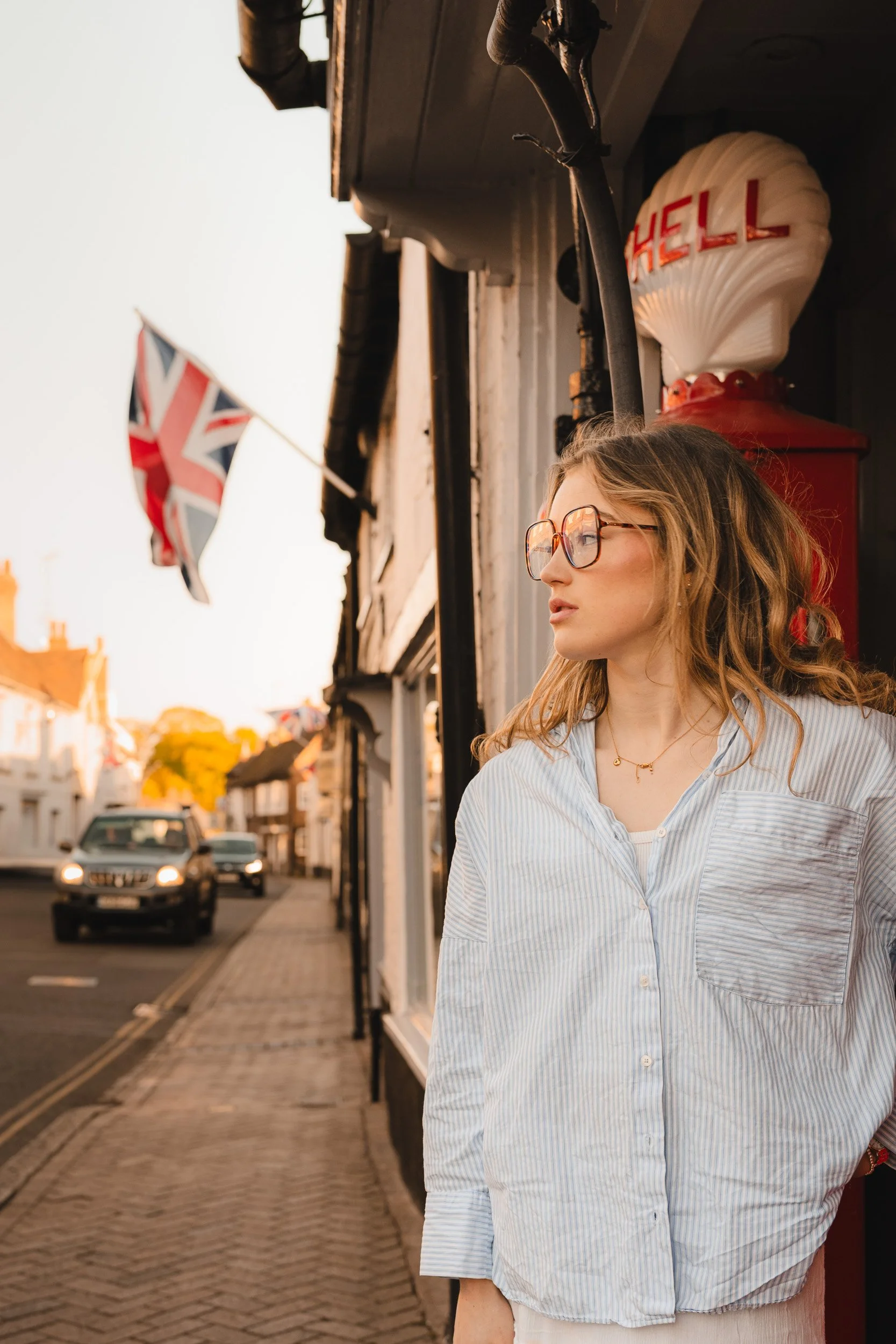 Relaxed and natural school leaver portrait  session at retro petrol station during golden hour in Great Missenden, Buckinghamshire