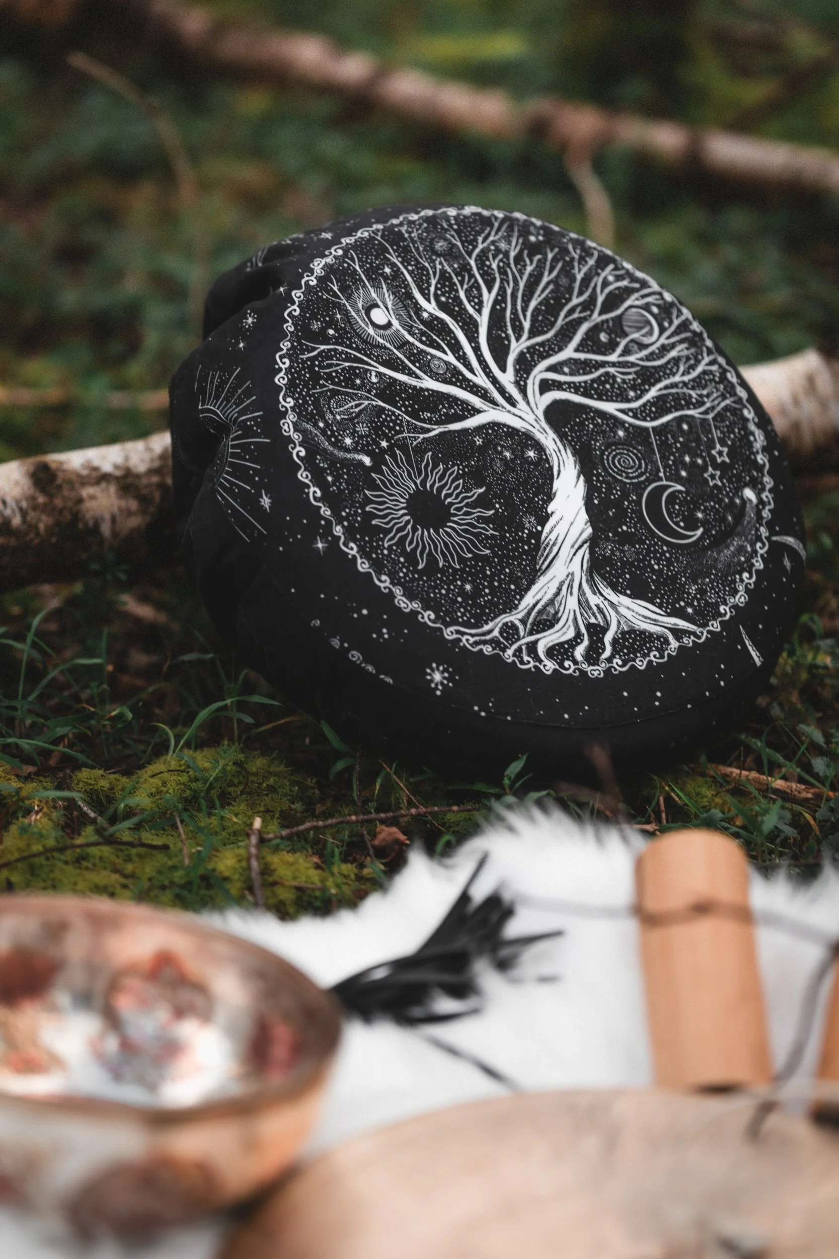 Shamanic drum with tree of life design and singing bowl details from a branding photoshoot in Amersham Buckinghamshire