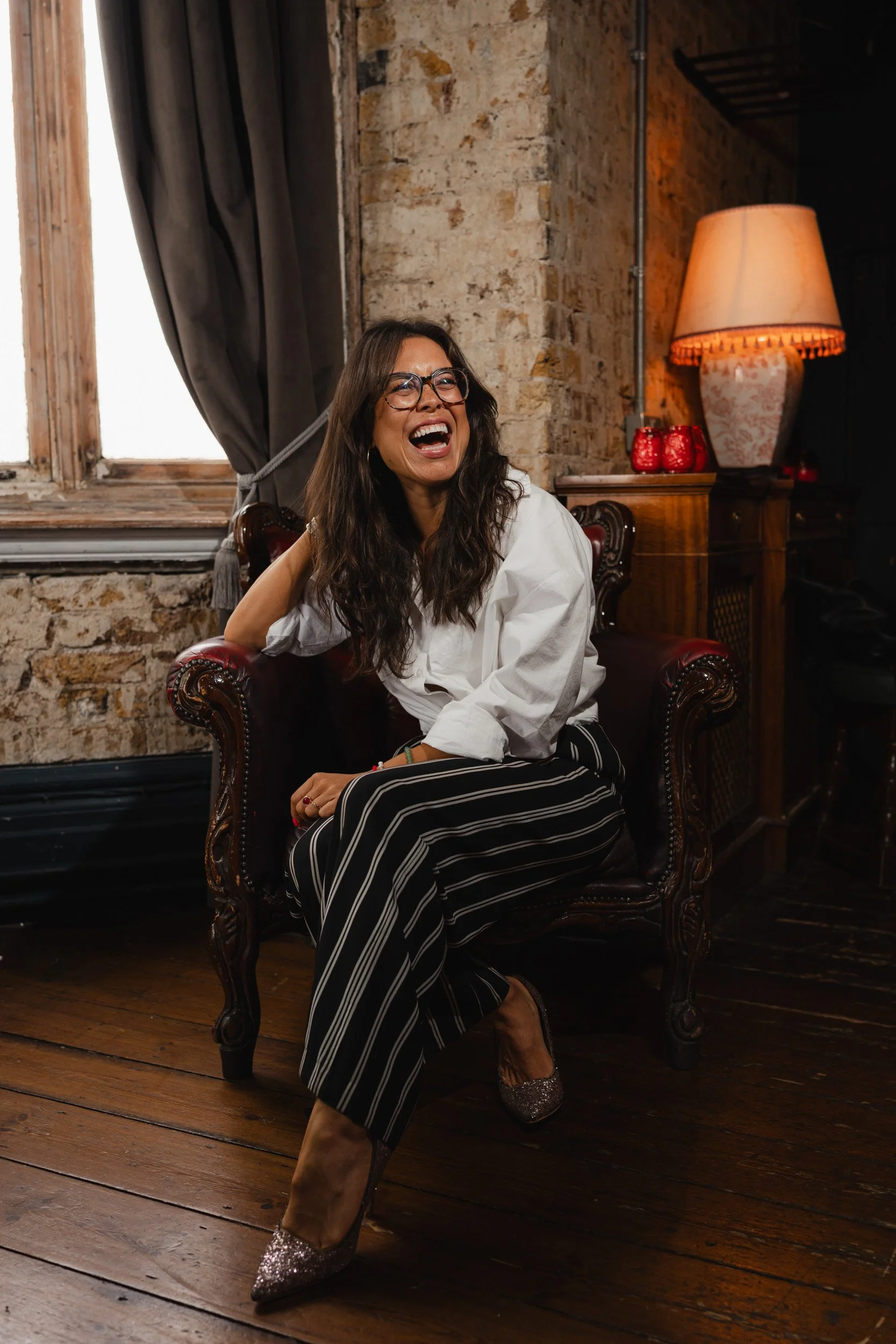 Life coach Alice Dartnell smiling at a headshot session in London for her personal branding