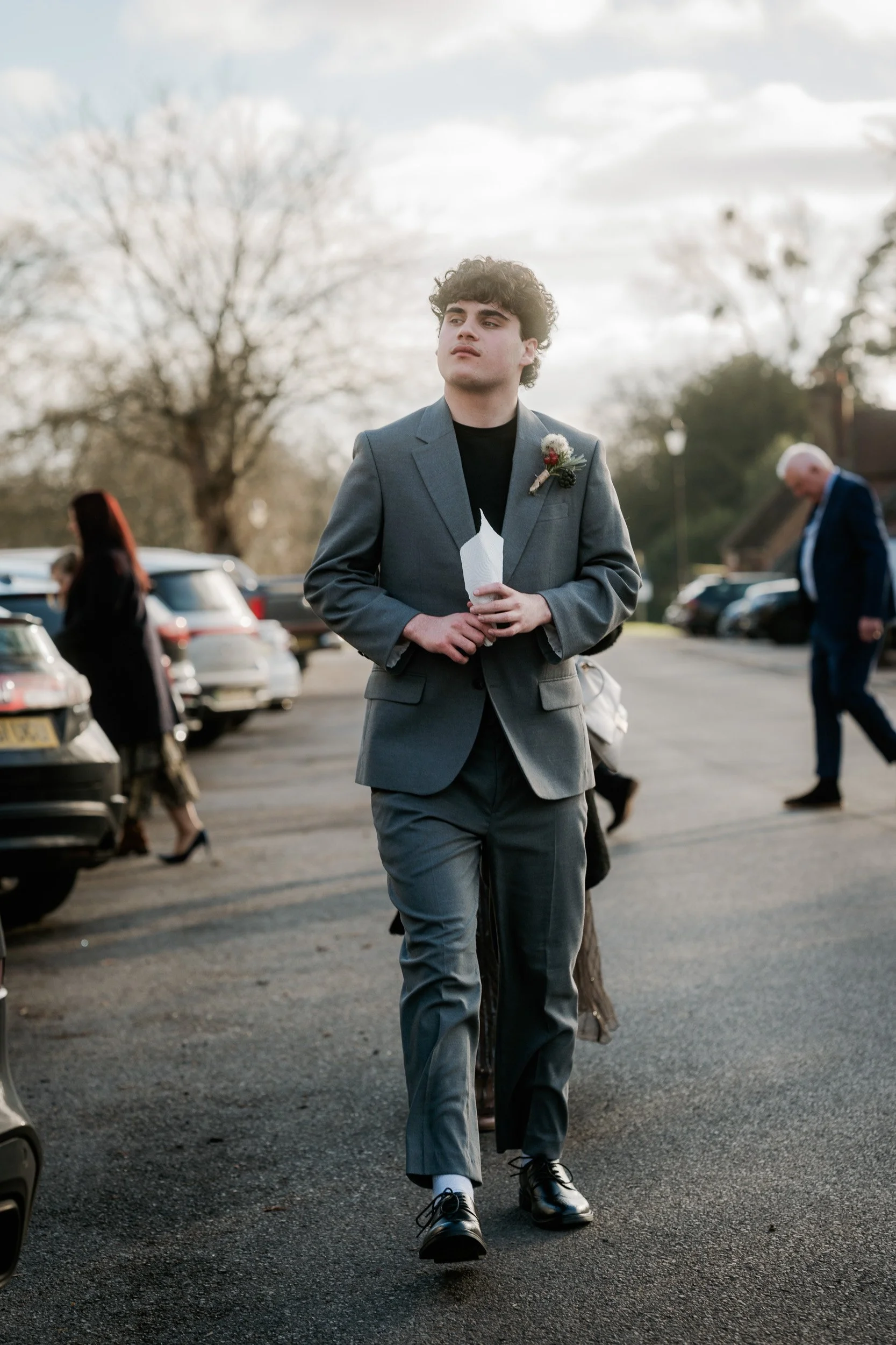 Best Man walking through towards Old Beaconsfield Registry Office in  Buckinghamshire towards a wedding ceremony