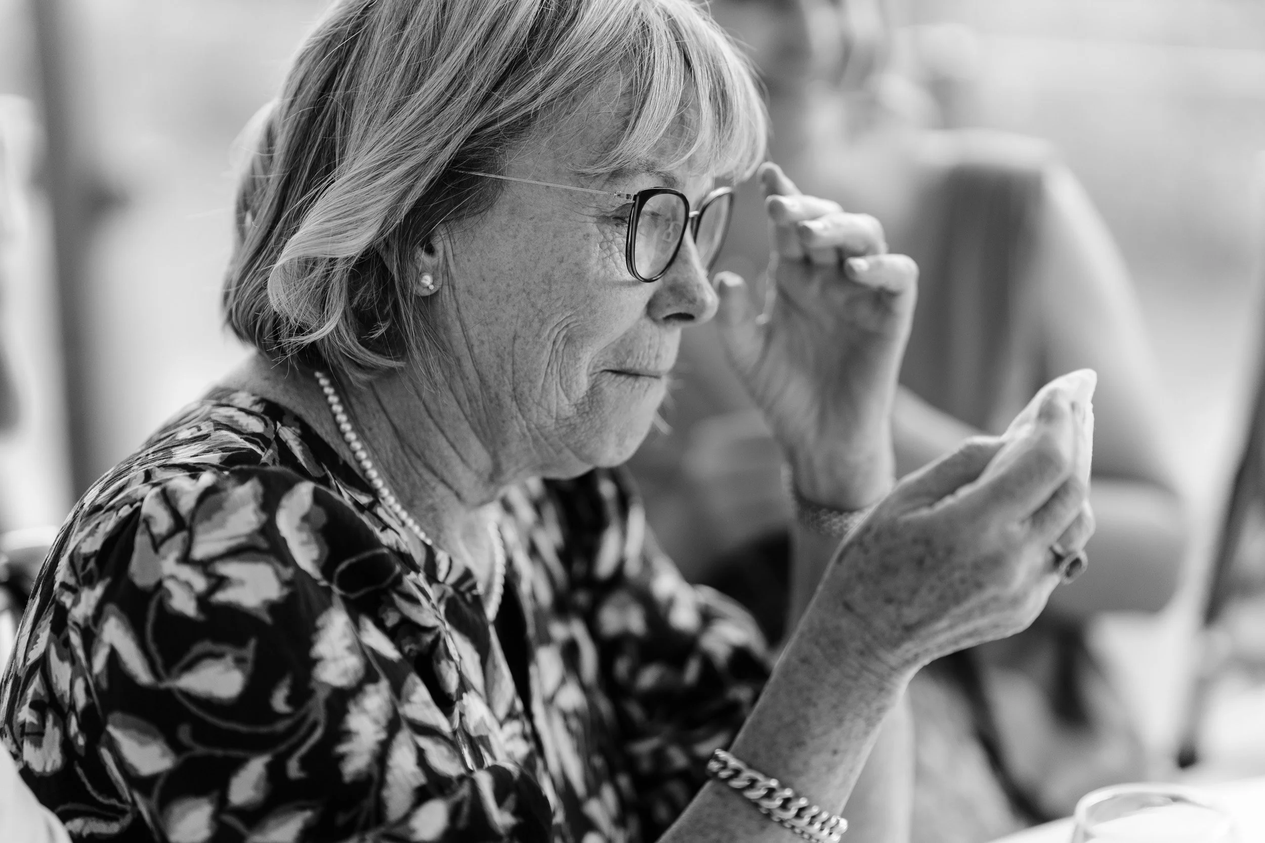 Mother of the groom tearfully reacting during the wedding speeches at Cherwell Boathouse in Oxford 