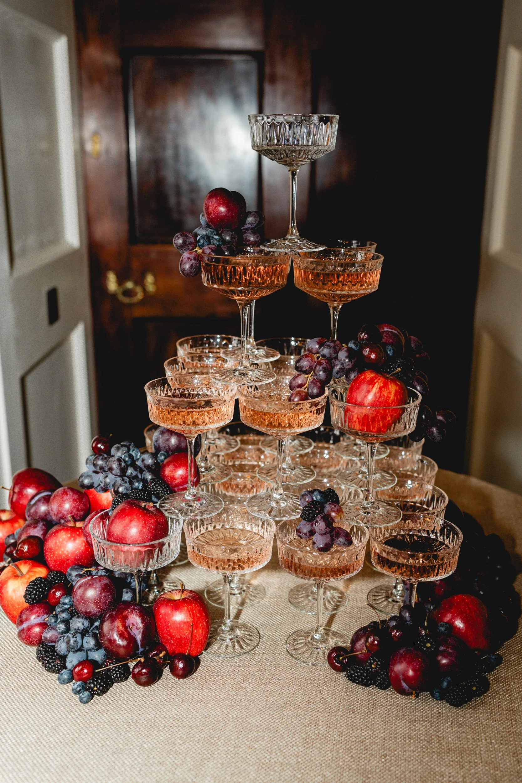 Champagne tower and fruit display at a wedding reception at Kirtlington Park in Oxfordshire