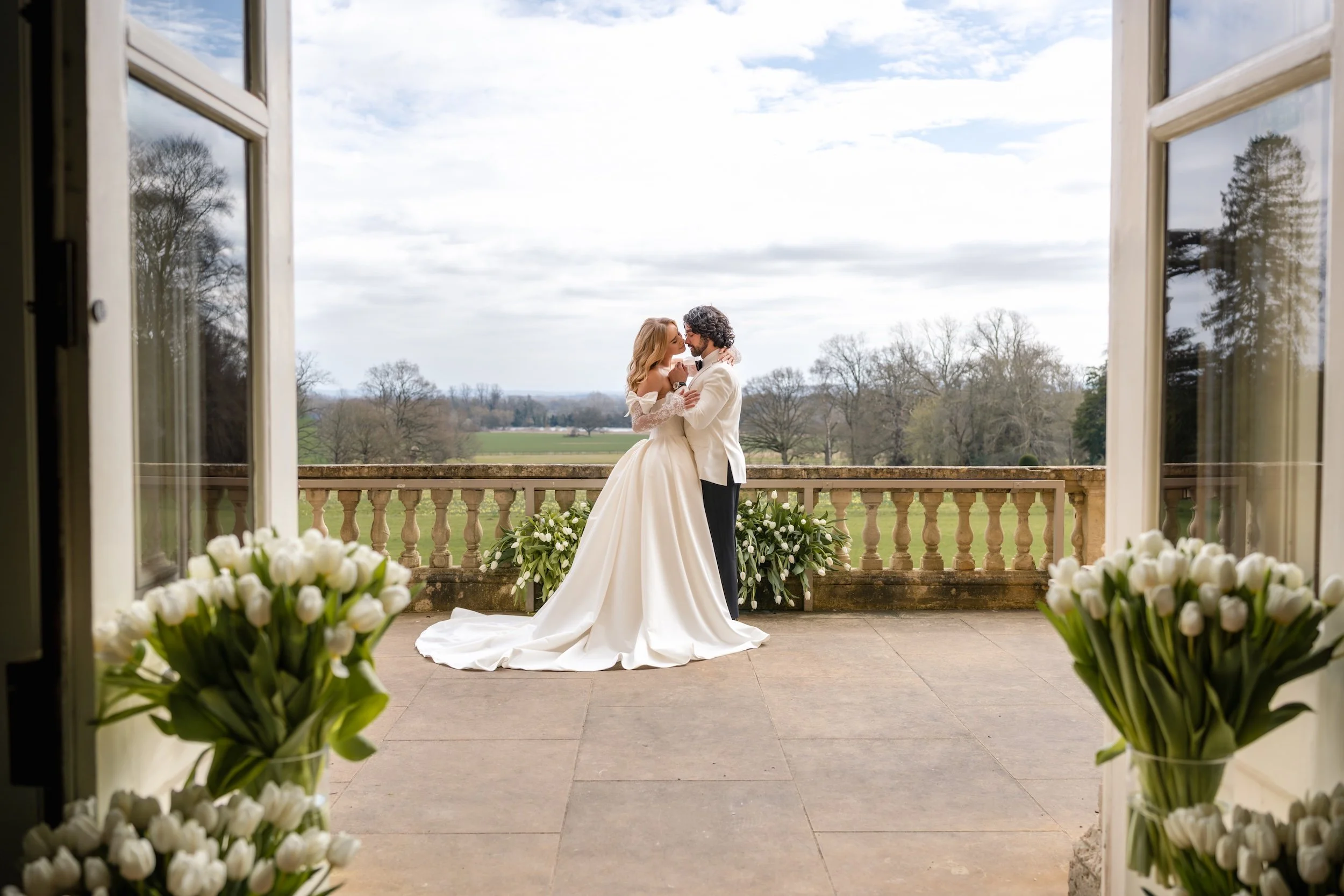 Bride and Groom portrait on the balcony at Kirtlington Park, an Oxfordshire wedding venu