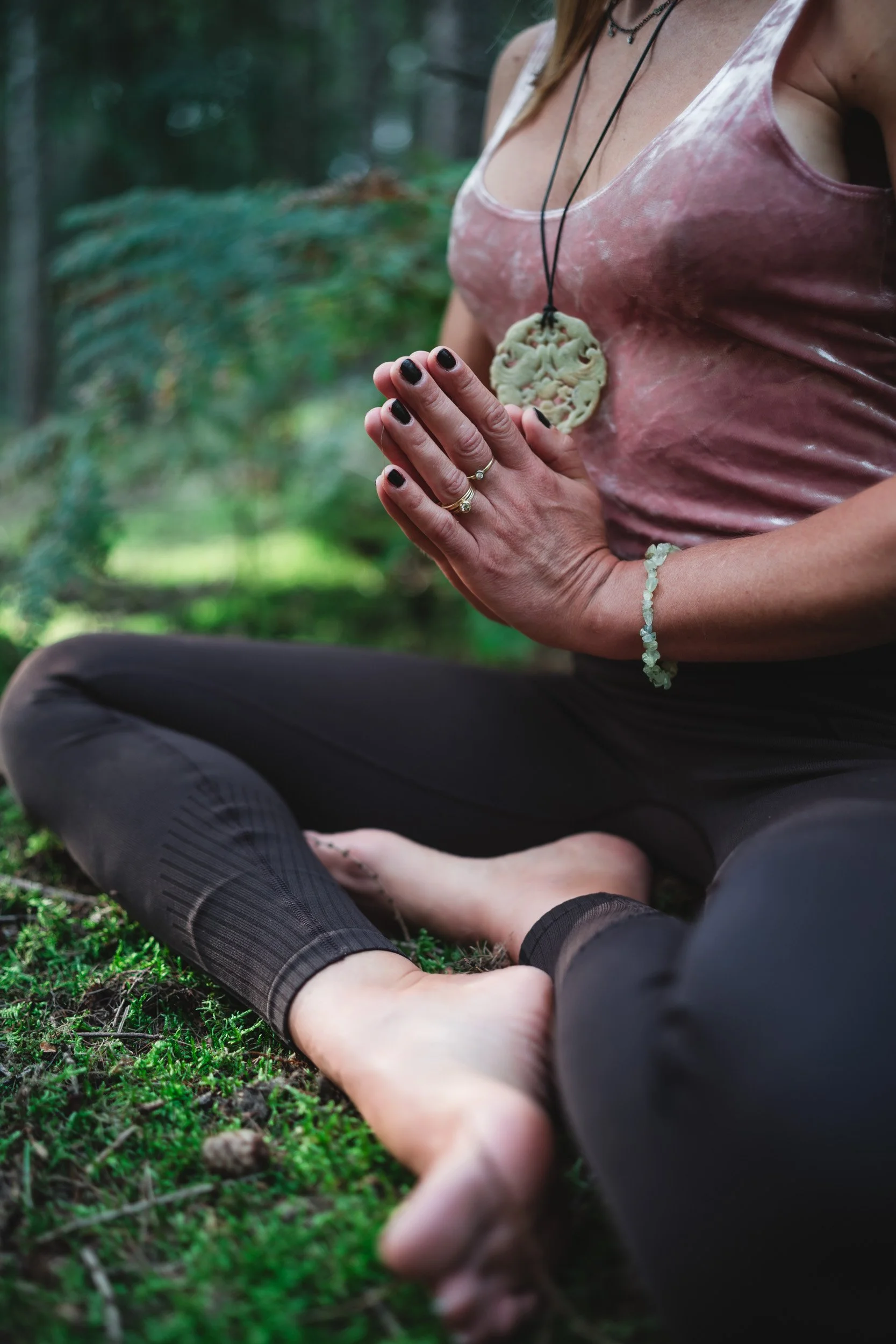 Yoga trainer practicing a yoga meditation in the woodland during a personal branding photoshoot in Black Park Buckinghamshire