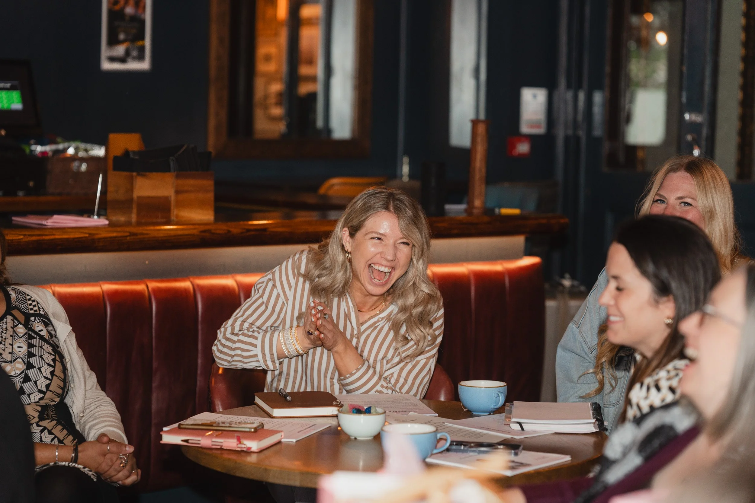 Women laughing during a business networking event in Hackney London