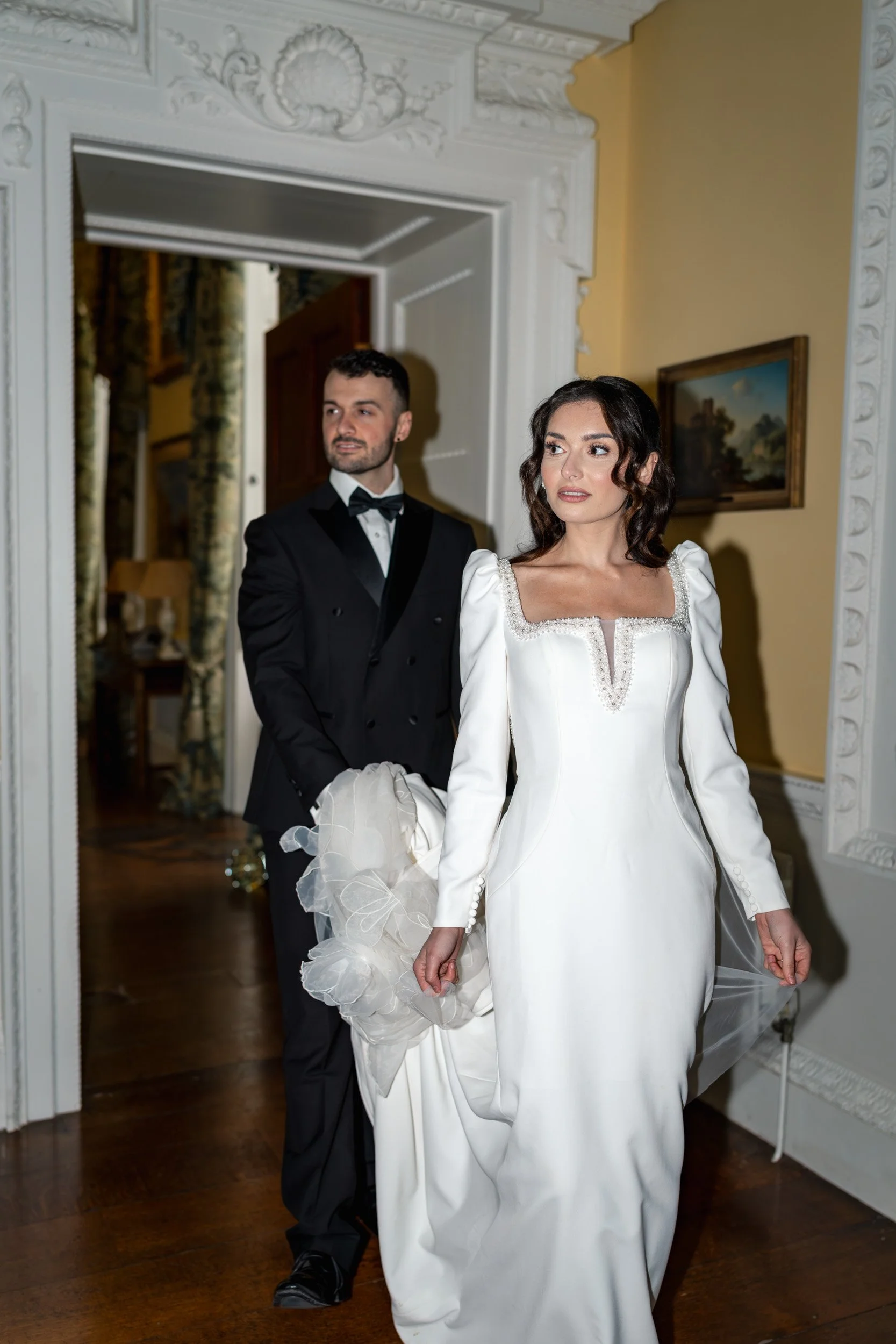 Bride and groom walking into their wedding reception at Kirtlington Park in Oxfordshire