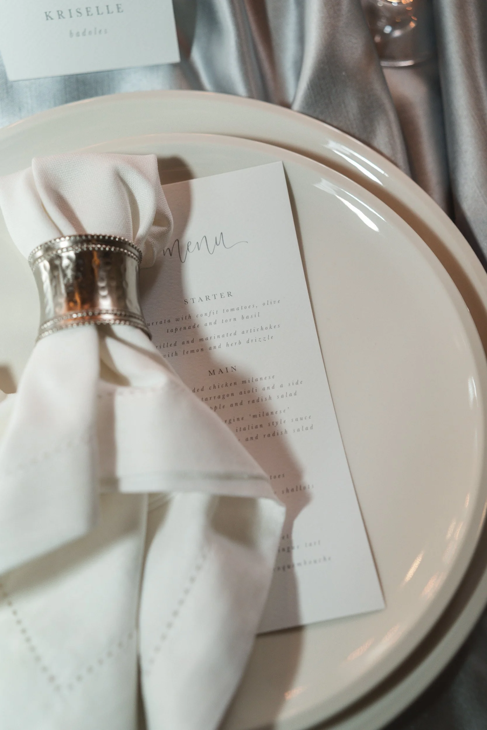 Close-up of a place setting at a  wedding reception table inside The Bell Tower at The Elvetham Hotel in Hampshire