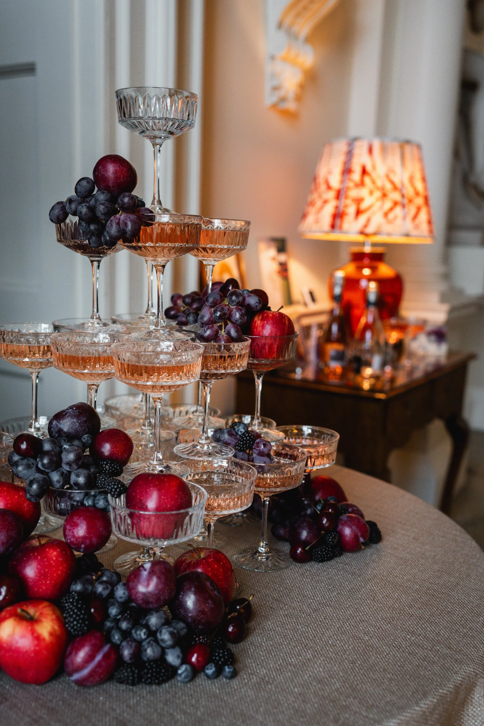 Champagne tower and fruit display at a wedding reception at Kirtlington Park in Oxfordshire