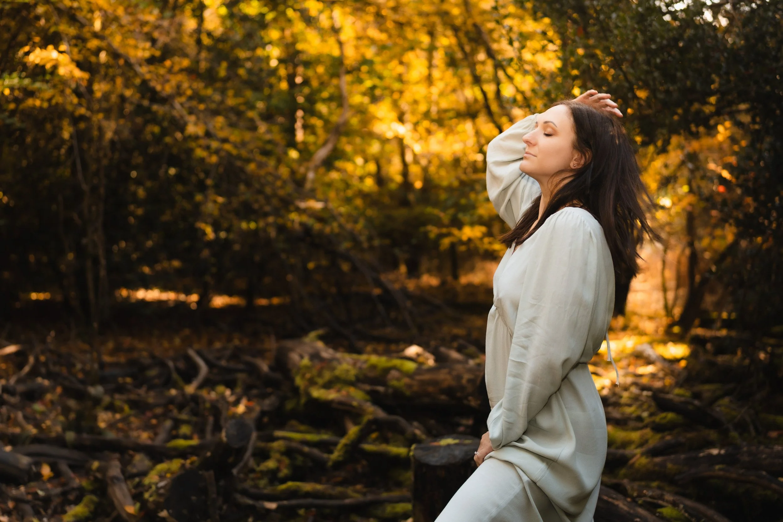 Mother feeling strong at at peace in a woodland motherhood empowerment  photography session in woods in Amersham, Buckinghamshire 