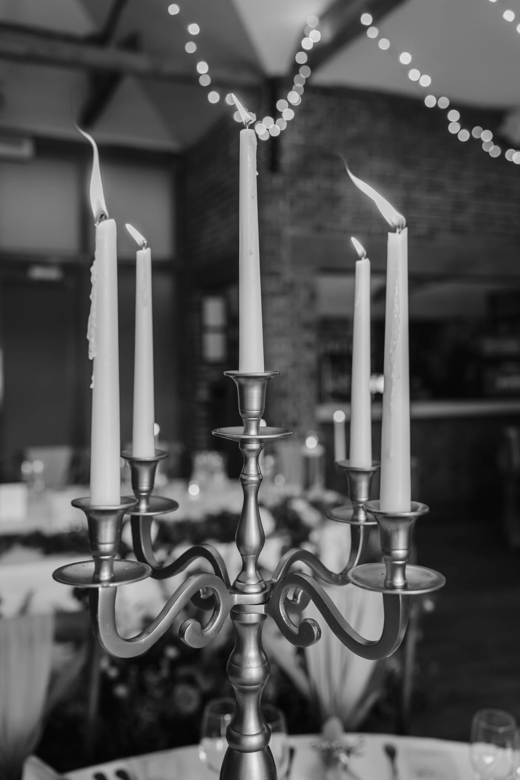 Lit candelabra during a wedding reception at Wasing Park in Berkshire