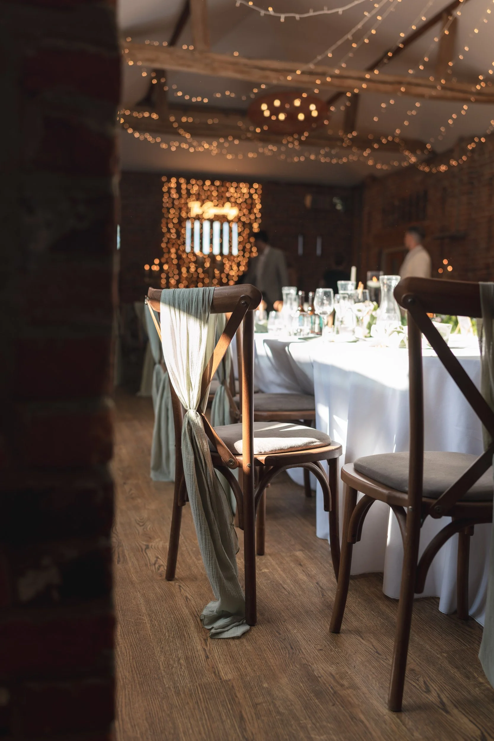 Table setting in a room lit with fairy lights at Wasing Park in Berkshire 