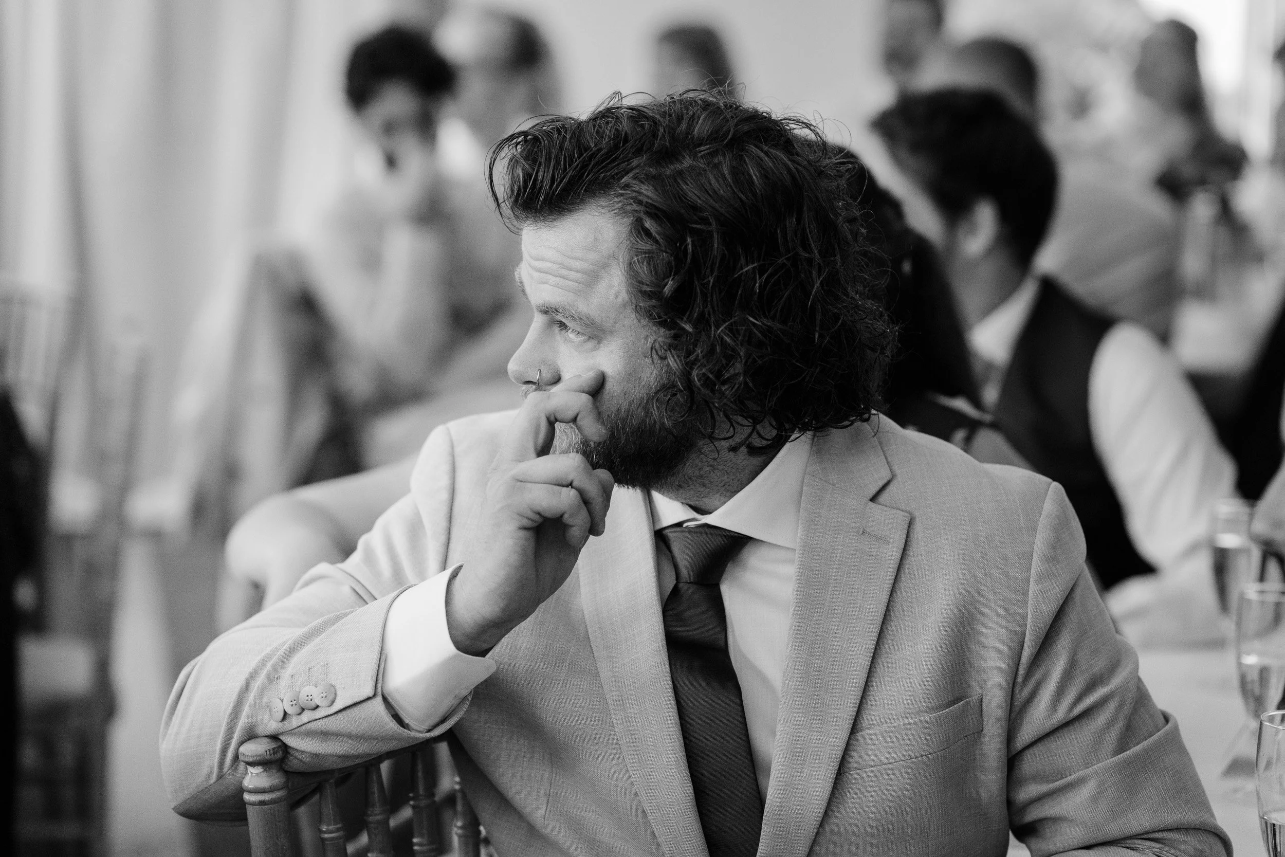 Grooms brother tearfully reacting during the wedding speeches at Cherwell Boathouse in Oxford 
