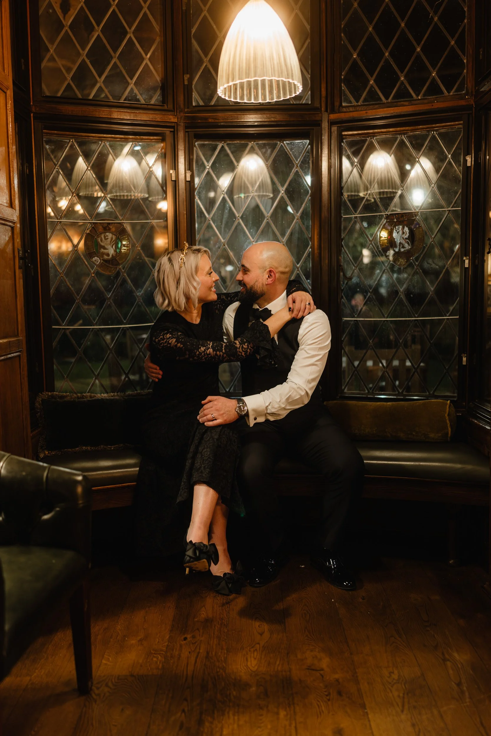 Bride and groom sharing an intimate moment at their wedding reception at The Bedford Arms in Chenies 