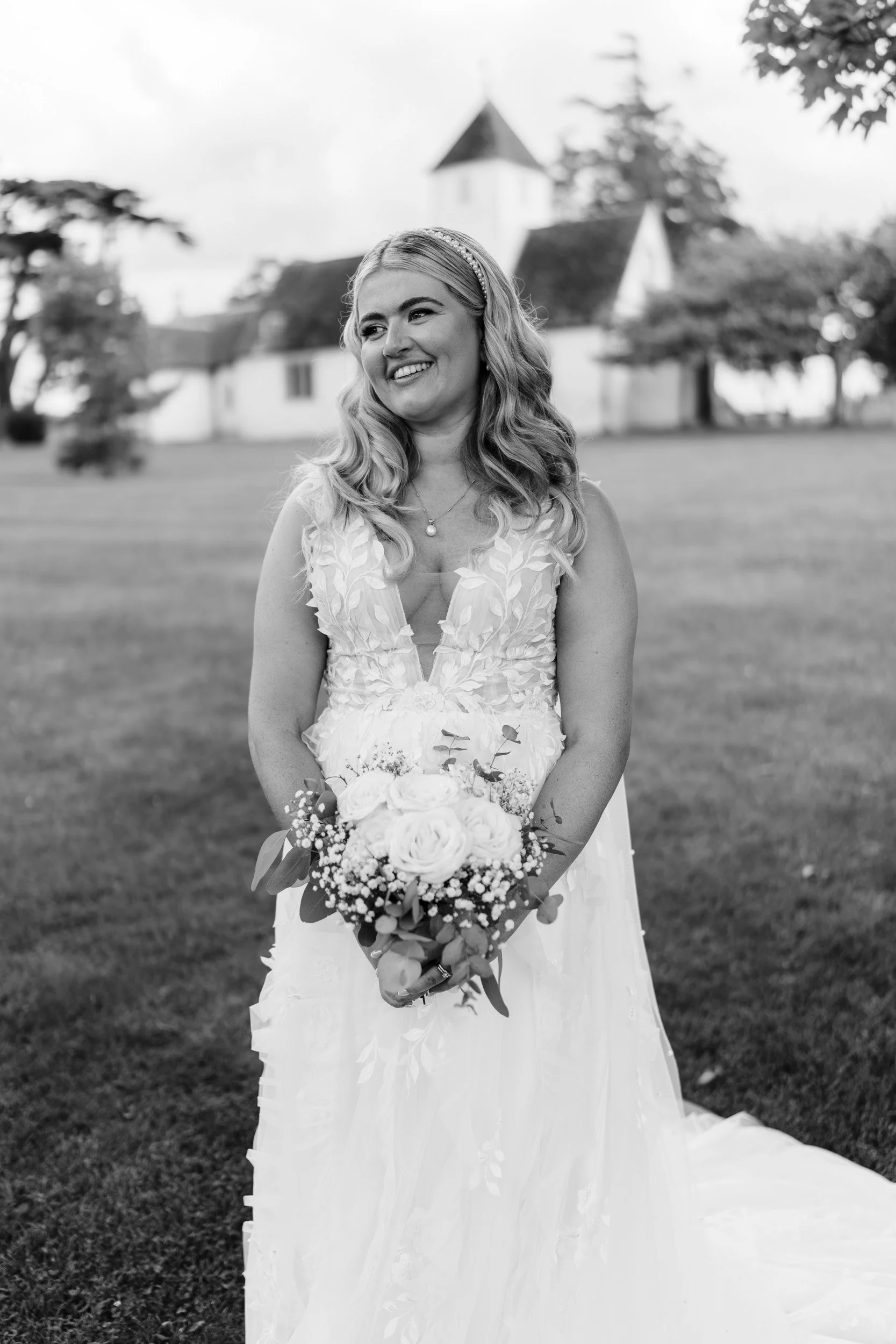 Happy bridal portrait taken after an outdoor garden ceremony  Wasing Park in Berkshire