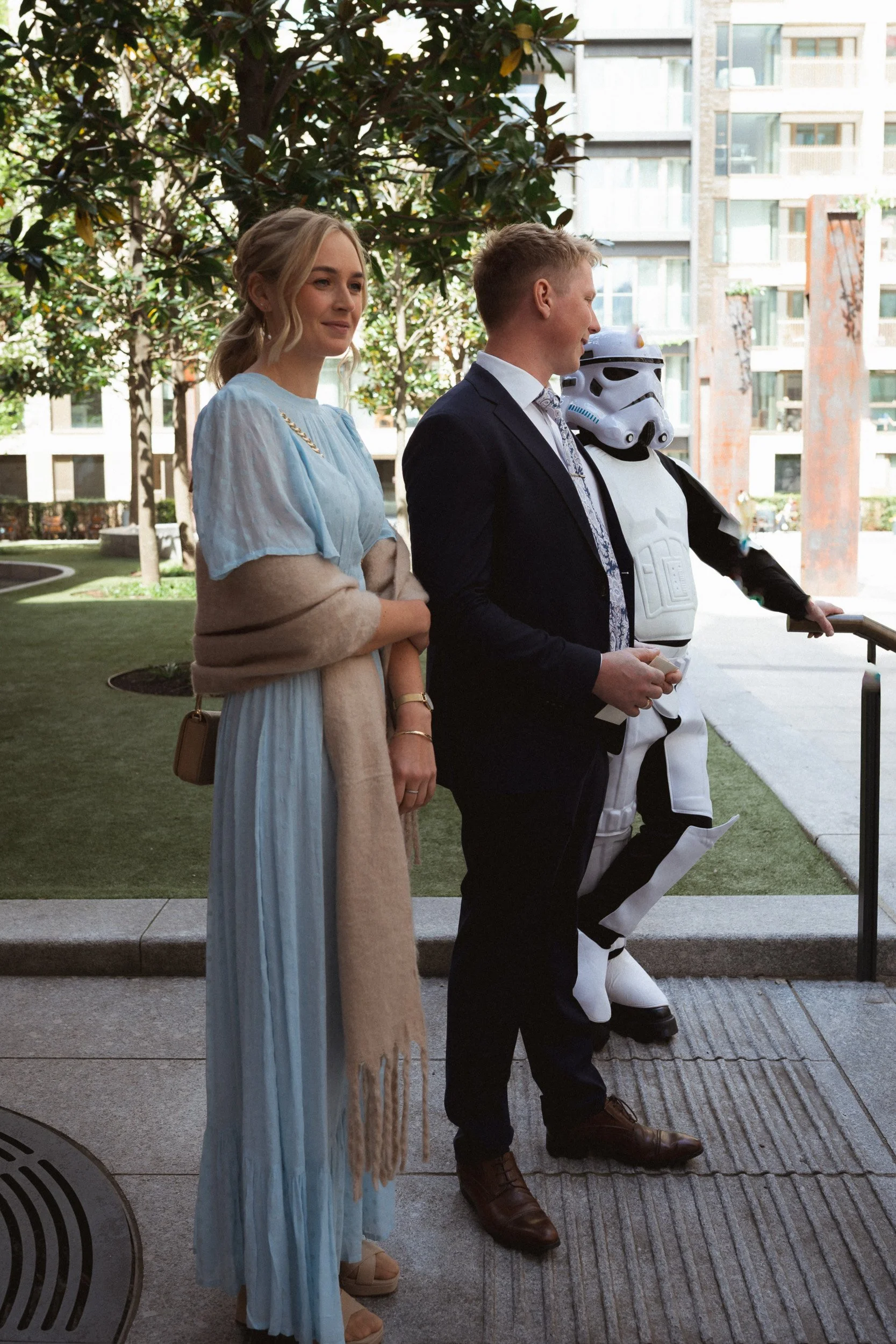 Wedding guests and a storm trooper outside Fitzrovia Chapel in London on a May the Forth be with you wedding