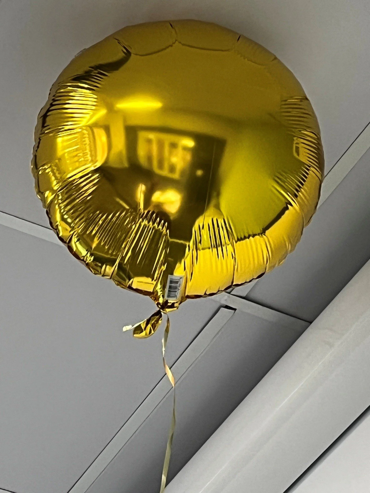 Gold balloon rising up.jpg