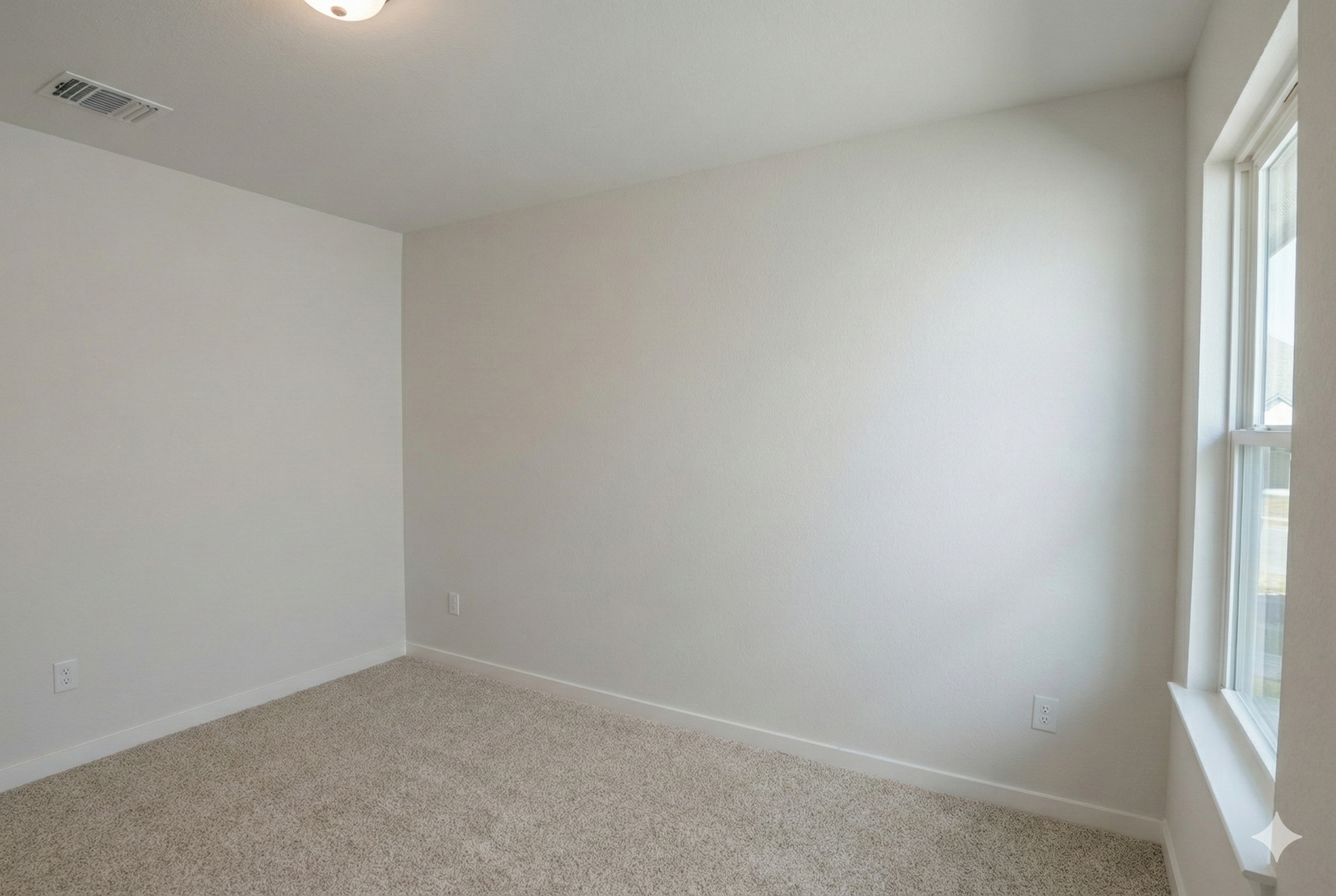 "Professional real estate photography of a vacant second bedroom shot from the corner to show the window and natural lighting. Newly built 1,500 sq ft home in Central Texas serving Austin, Round Rock, Georgetown, Killeen, Temple, and Waco - Focus Poi