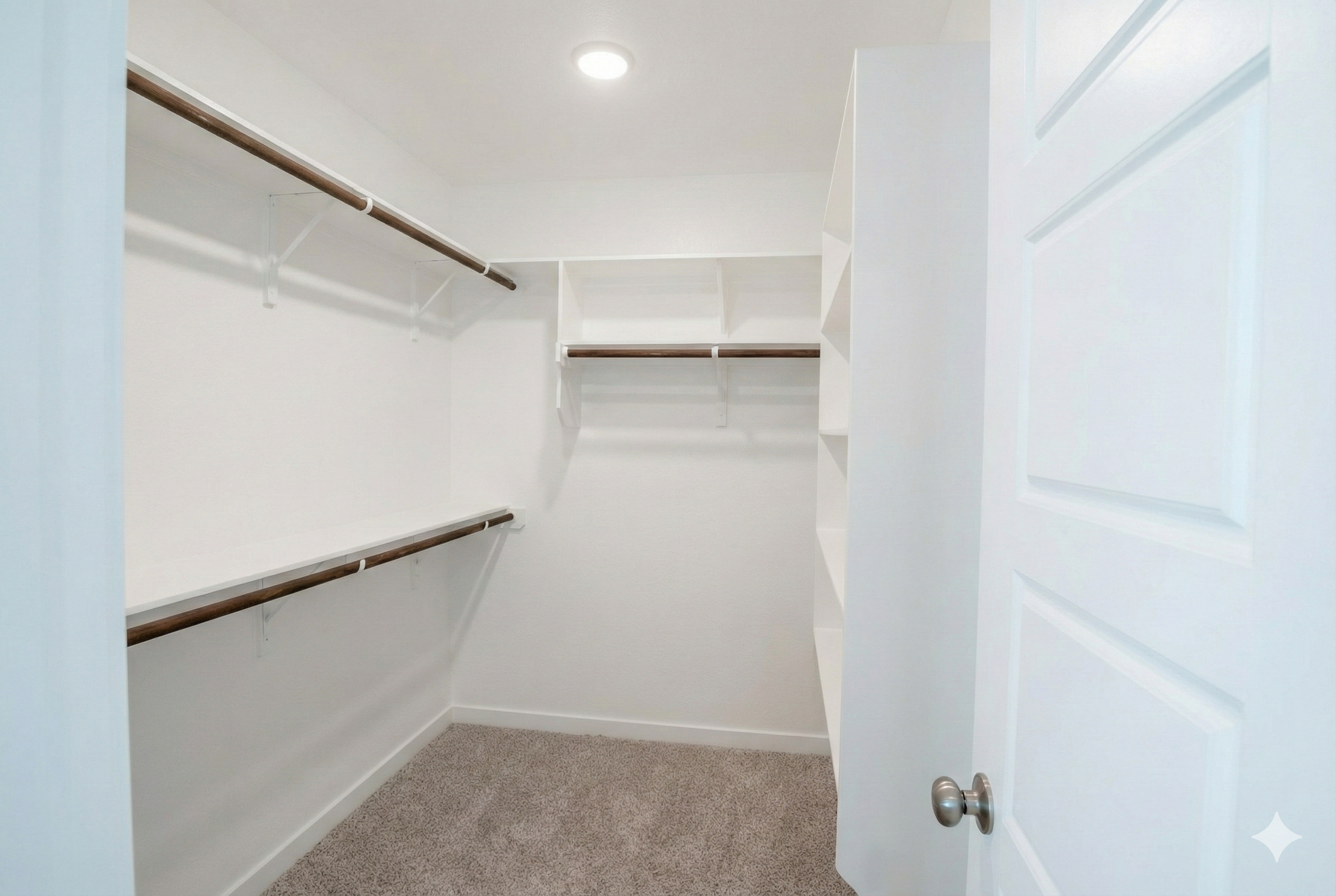 "Professional real estate photography of a vacant walk-in closet with a long-view perspective in a newly built 1,500 sq ft home. Serving Austin, Round Rock, Georgetown, Killeen, Temple, and Waco – Focus Point Media."