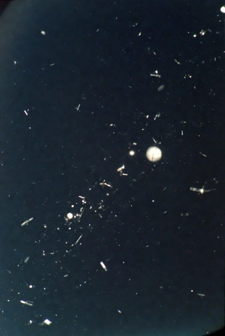 view of space junk and old satellites floating around