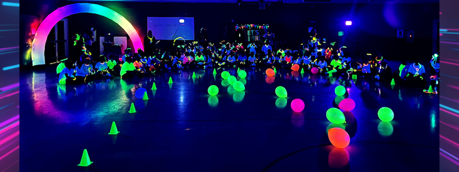 Glow-in-the-dark balloons, cones, and outfits, participating in a glow-in-the-dark event or party.