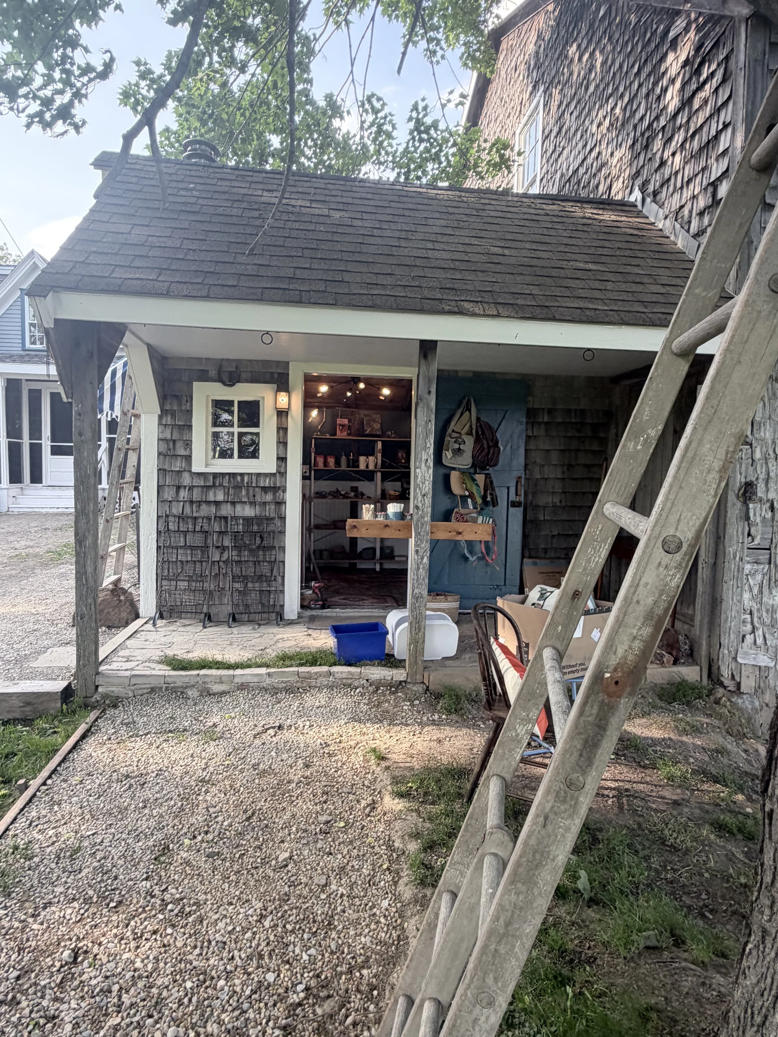 Entrance to coffee shop & Farmhouse store - a converted milking shed - handmade drums, rattles, globally made art, crystals, books, baked goods.