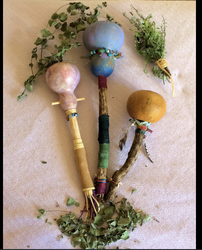 Three decorated gourds attached to sticks to create a rattle. Come make your own! Workshop to make your own sacred rattle.