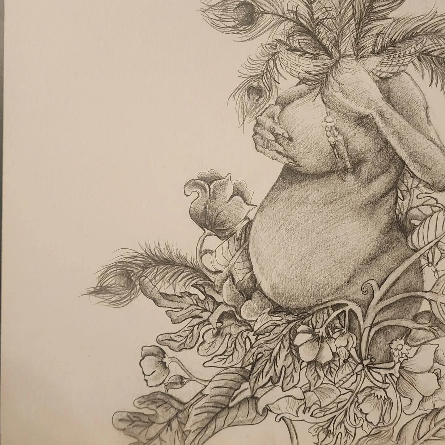 A detailed pencil drawing of a woman with her face covered by her hand, surrounded by flowers and leaves.
