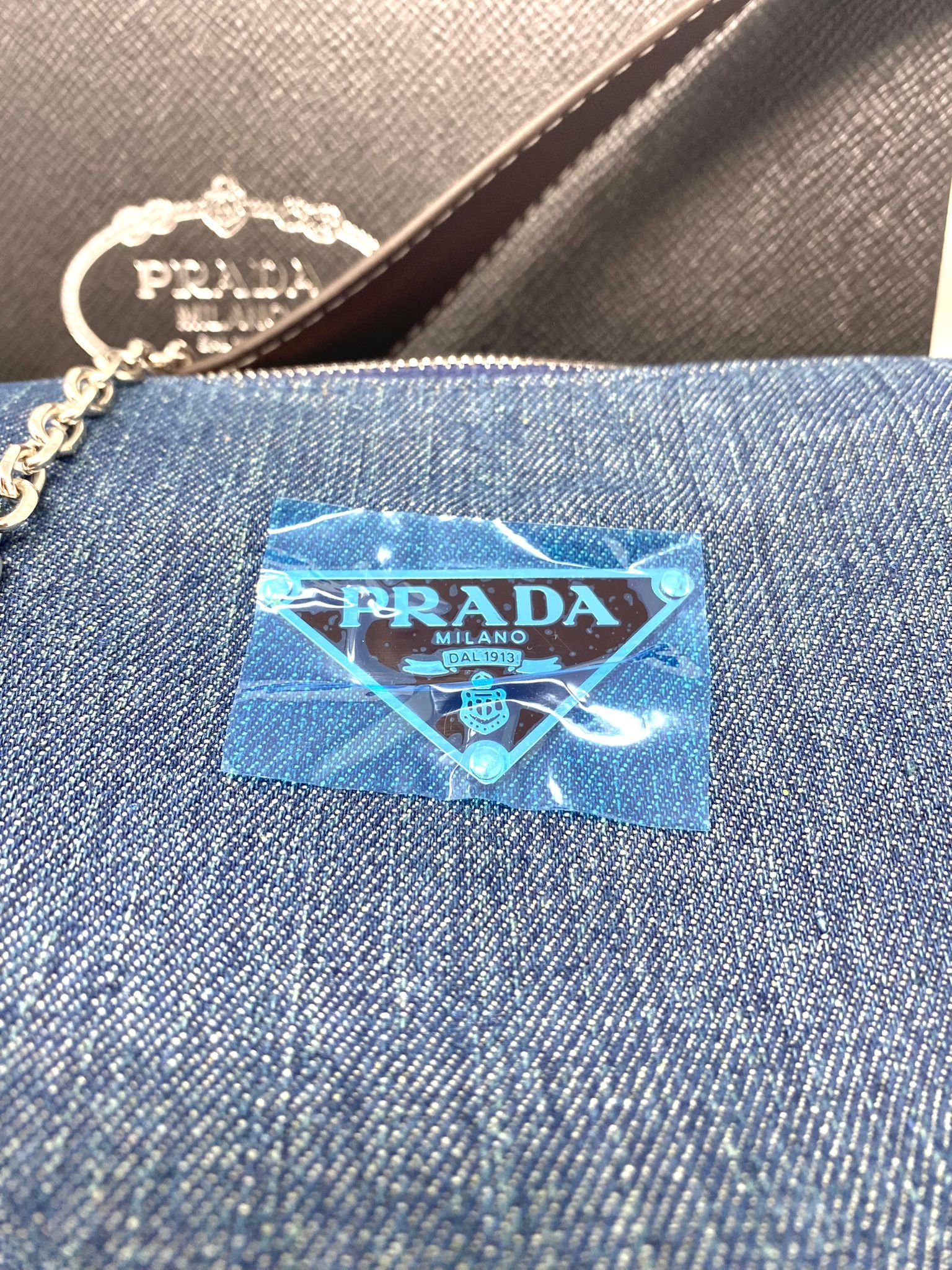 PRADA Milano Denim Shoulder Bag, Blue Canvas Mini Baguette Pochette, Silver Chain Strap, Adjustable Leather Handle, Boxed