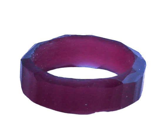 A dark-colored, hand carved wax ring.